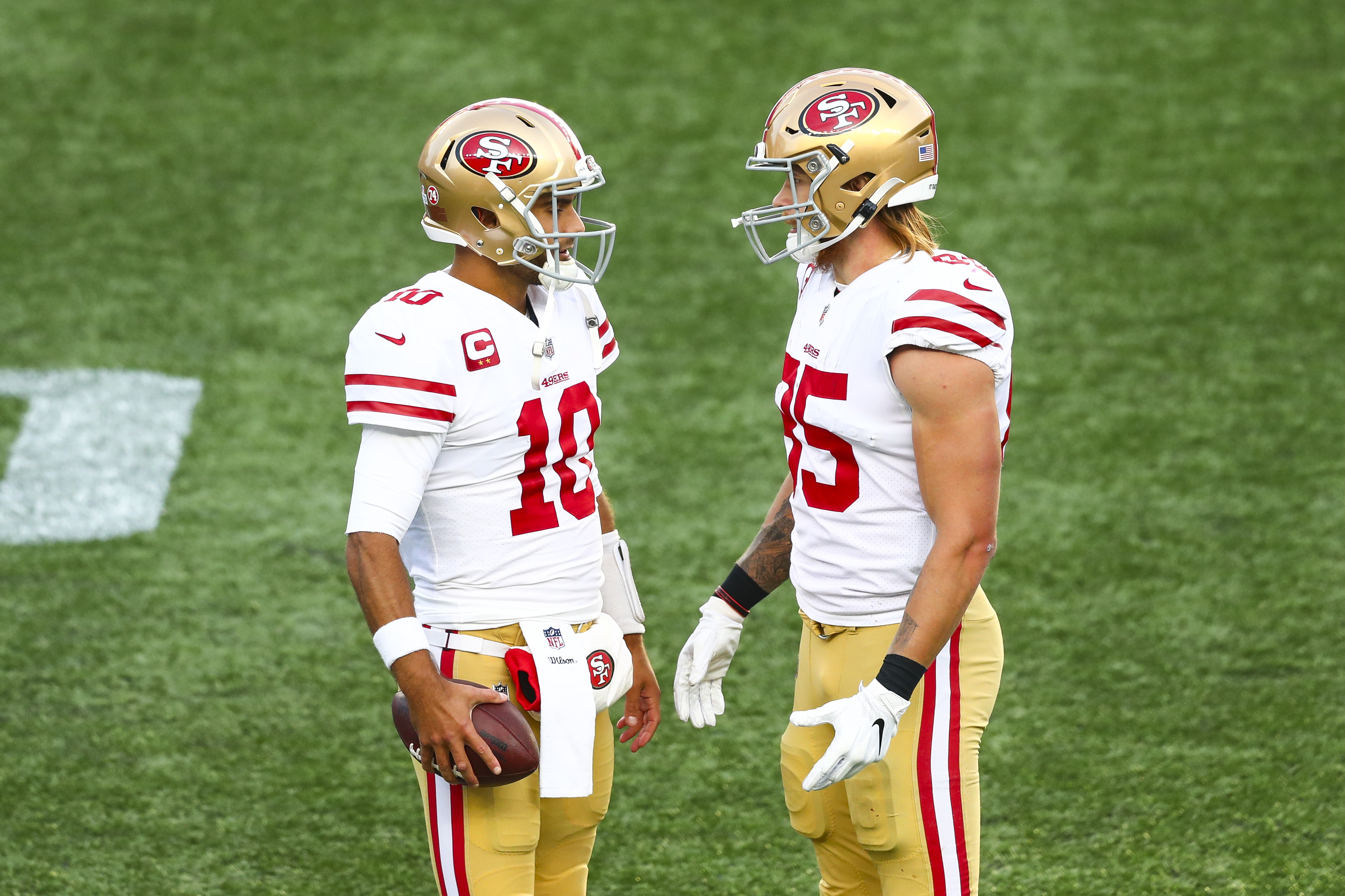 49ers quarterback Jimmy Garoppolo talks to George Kittle during game