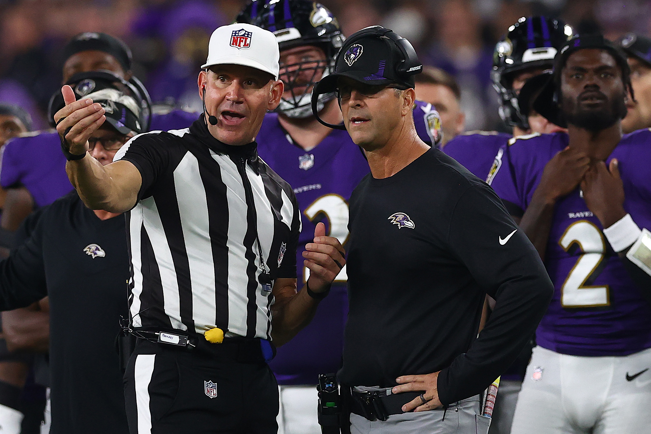Baltimore Ravens head coach John Harbaugh talking to NFL referee
