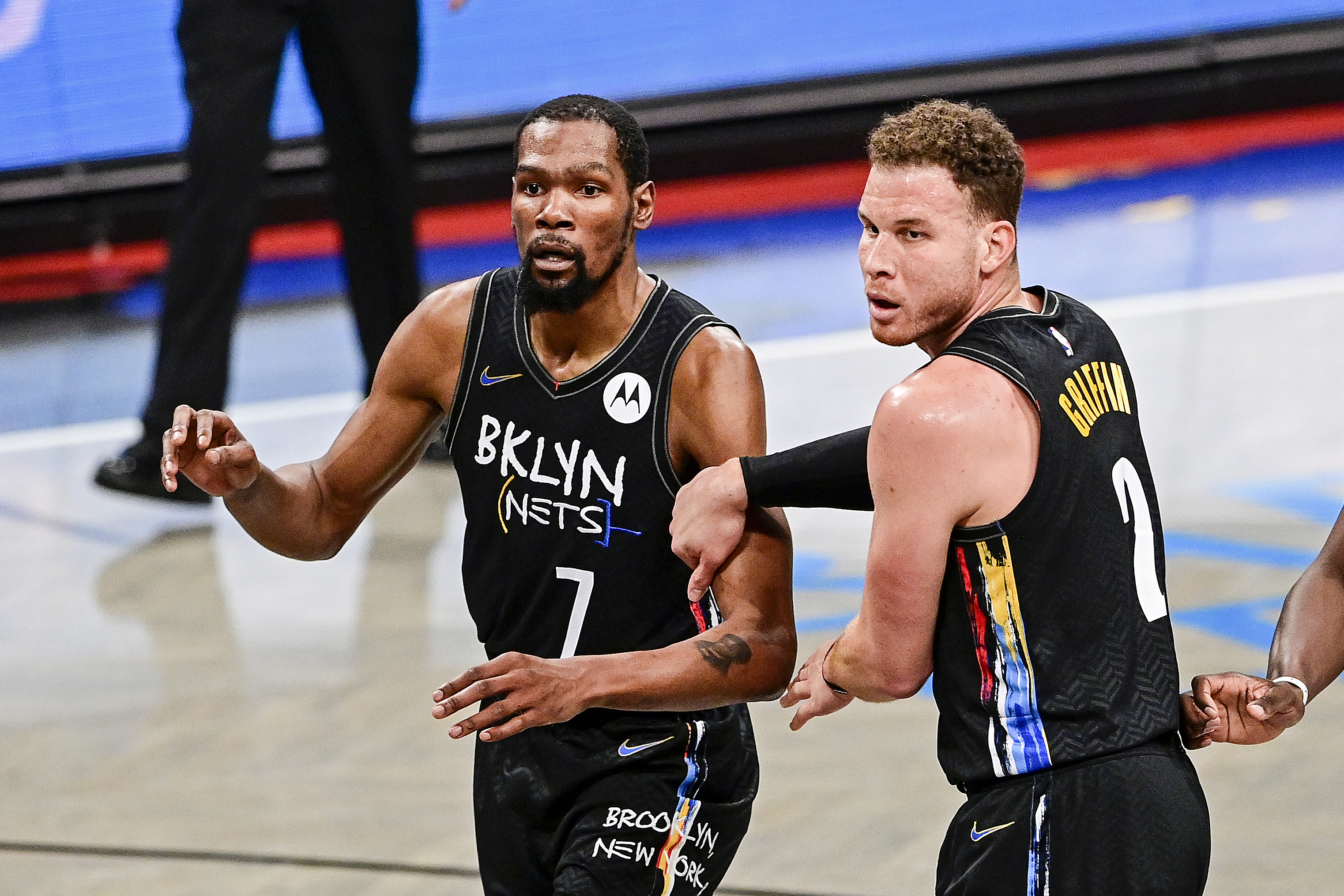 Nets teammates Kevin Durant and Blake Griffin react during a playoff game