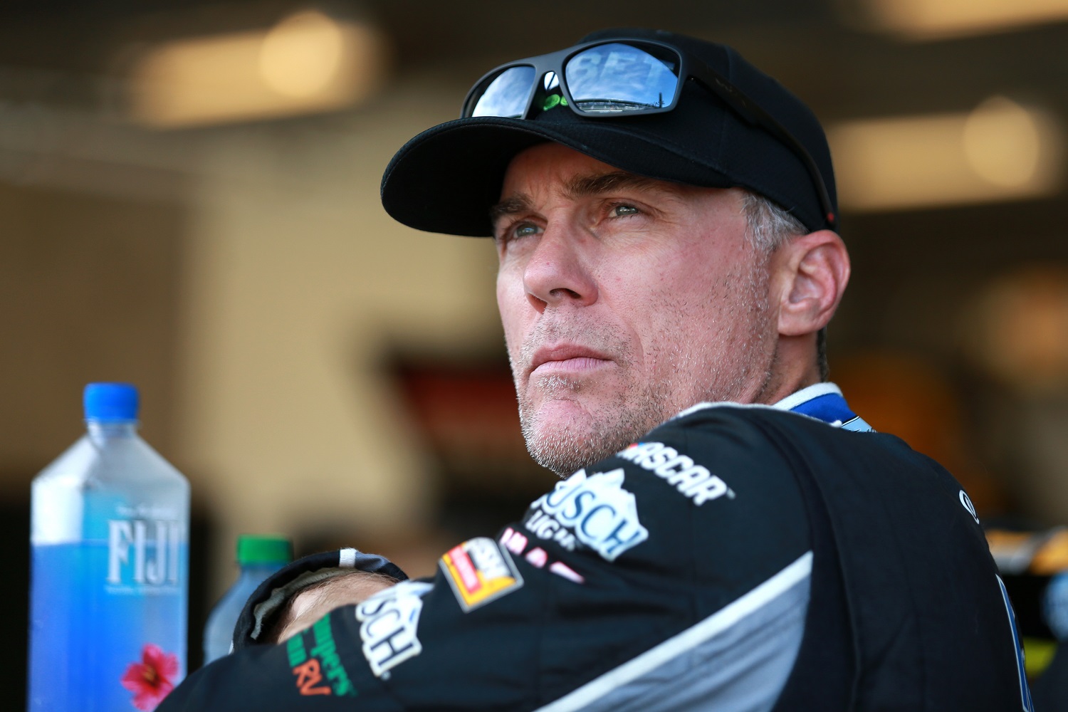 Kevin Harvick waits in the garage area during qualifying for the NASCAR Xfinity Series Pennzoil 150 at the Brickyard at Indianapolis Motor Speedway on Aug. 14, 2021.