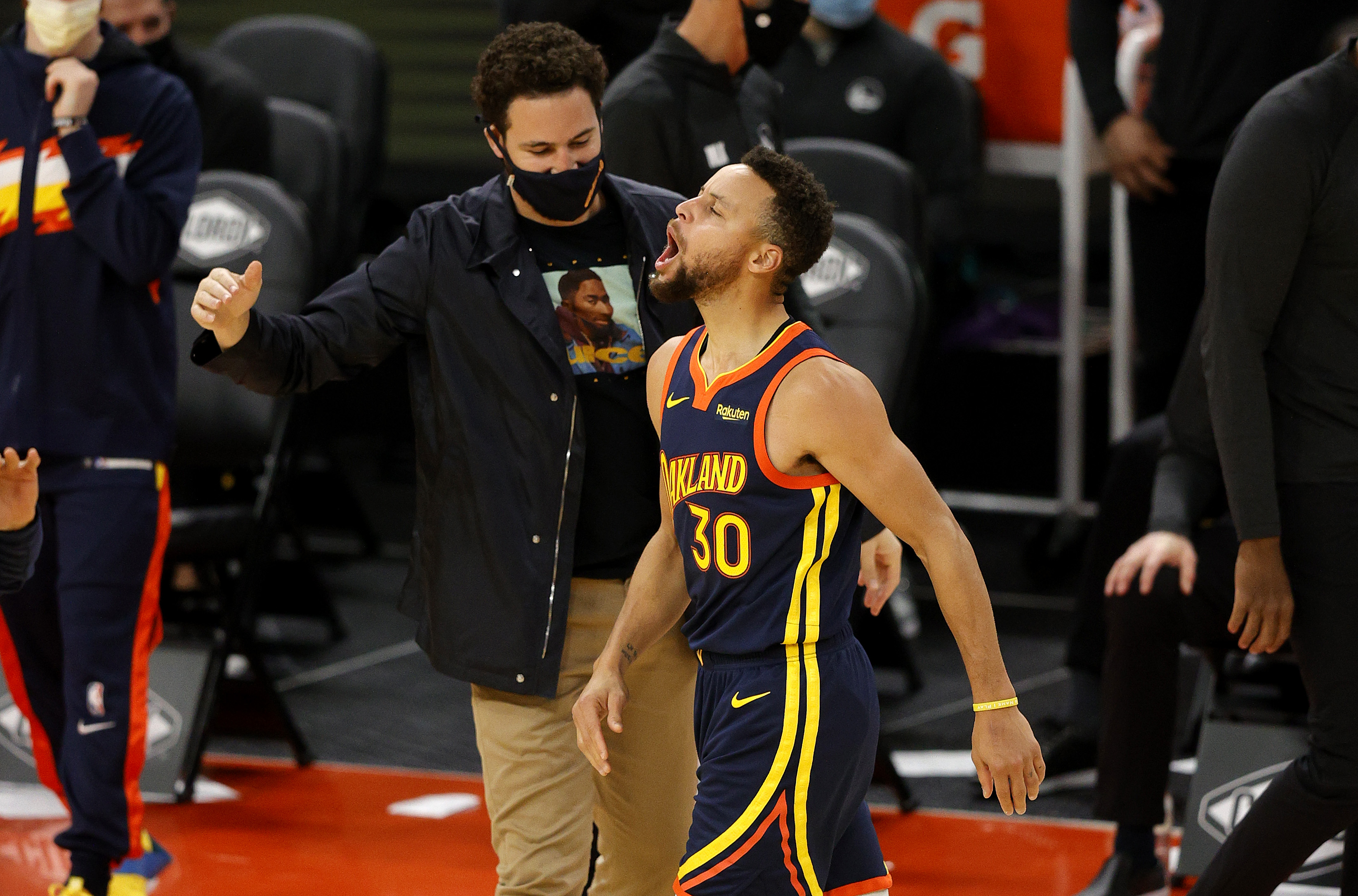 Warriors stars Klay Thompson and Stephen Curry react during a game in January