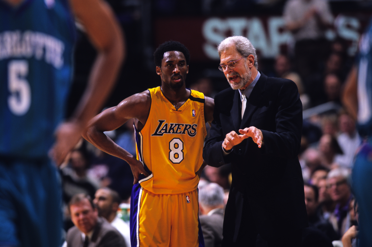 Los Angeles Lakers legends Kobe Bryant and Phil Jackson, who had a rocky relationship before later becoming close.