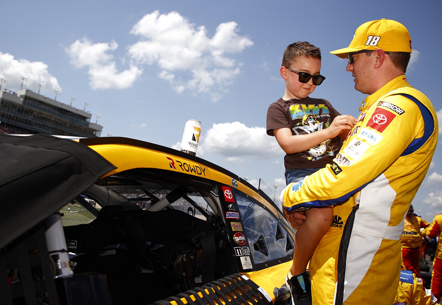 Kyle Busch, driver of the No. 18 Toyota, spends time with his son Brexton on the grid prior to the NASCAR Cup Series Ally 400 at Nashville Superspeedway on June 20, 2021.