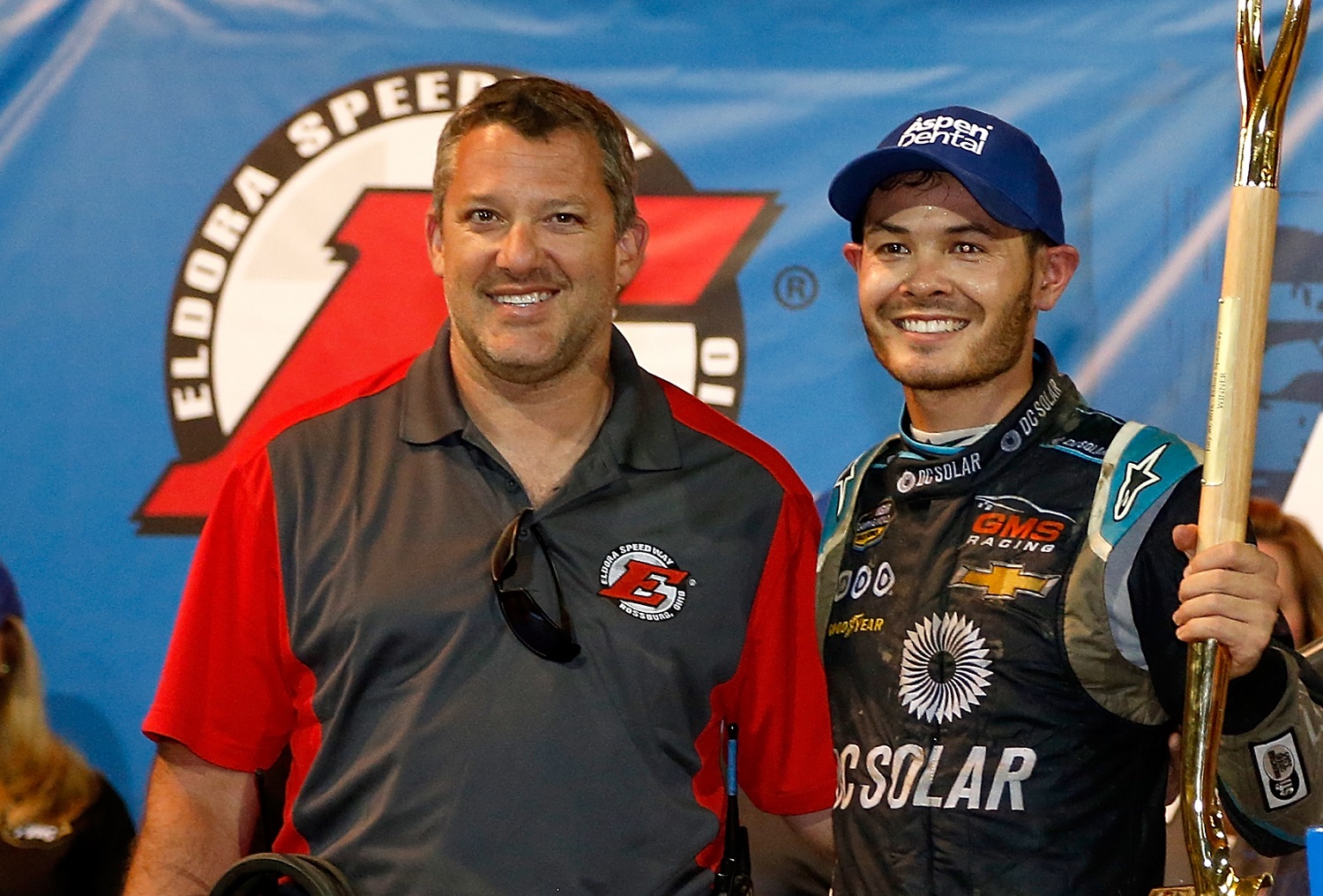 Kyle Larson poses with Tony Stewart after winning the NASCAR Camping World Series Aspen Dental Eldora Dirt Derby 150 on July 20, 2016.