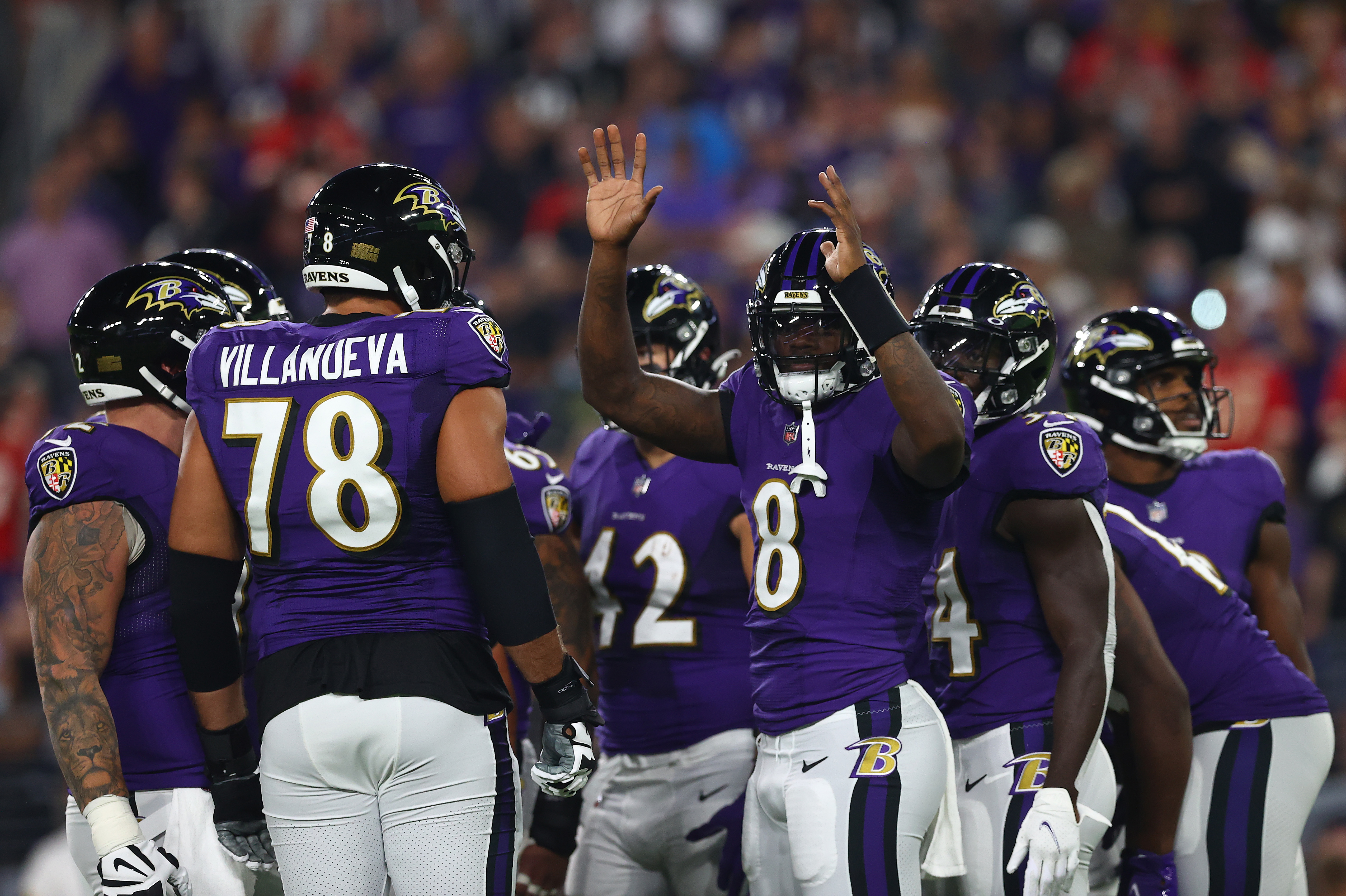 Lamar Jackson leads the Baltimore Ravens huddle