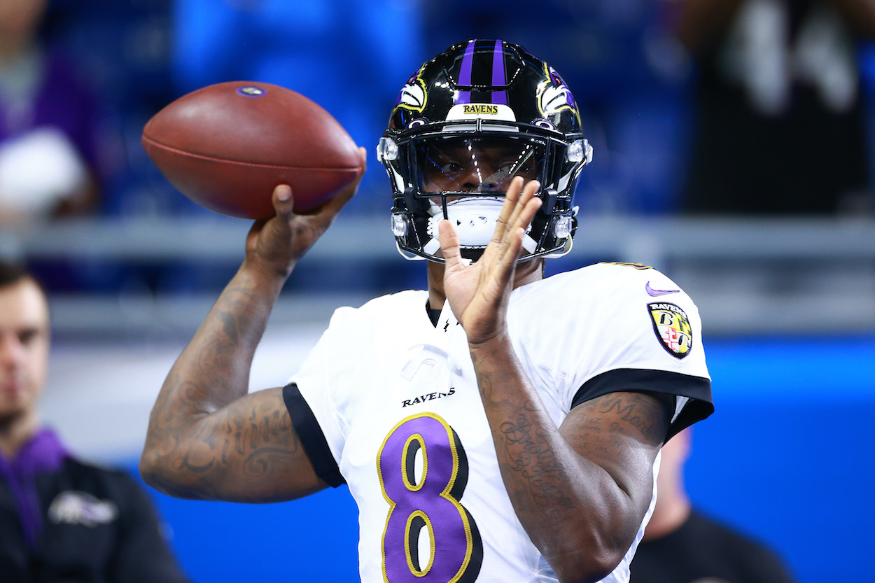 Lamar Jackson of the Baltimore Ravens warms up before the game against the Detroit Lions in the game at Ford Field on September 26, 2021 in Detroit, Michigan.