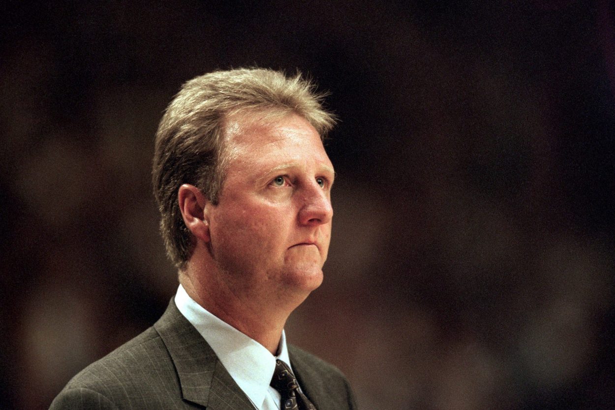 Former Pacers head coach Larry Bird looks at the clock during a playoff game in 1999