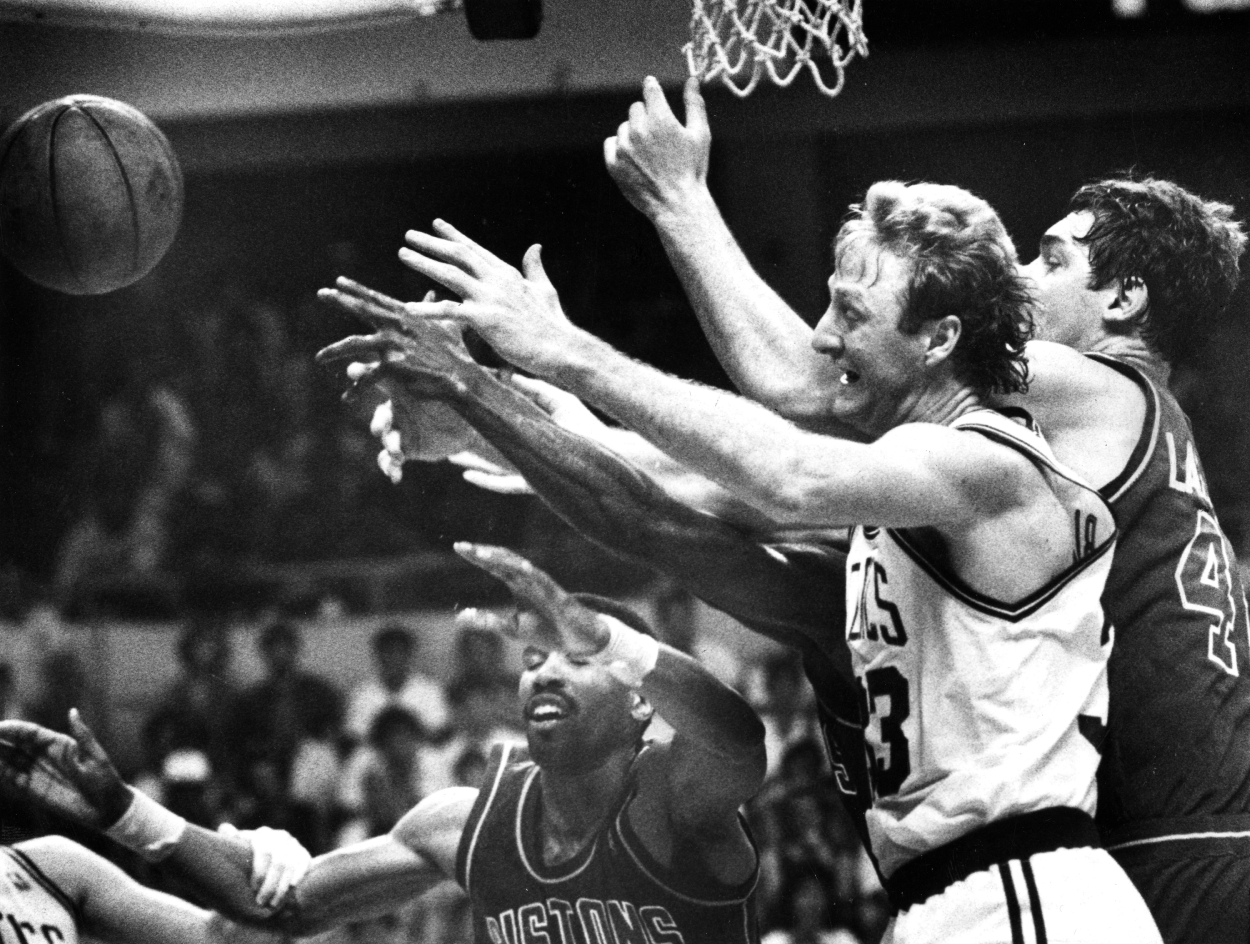 Boston Celtics' Larry Bird and Detroit's Bill Laimbeer, right, reach for the ball during the first half of Game 7 of the 1987 Eastern Conference Finals.