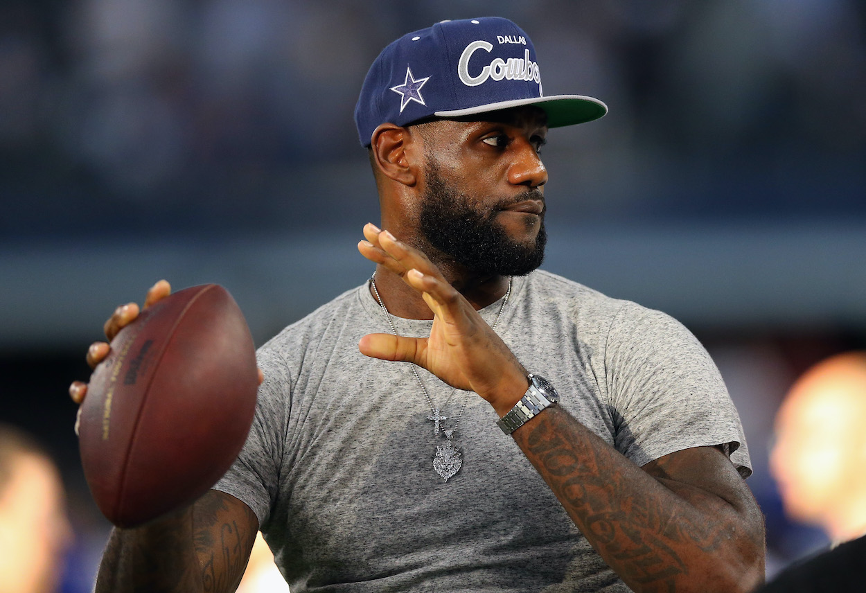 NBA player LeBron James of the Miami Heat throws a football at AT&T Stadium before a Sunday night NFL game between the New York Giants and the Dallas Cowboys on September 8, 2013 in Arlington, Texas.