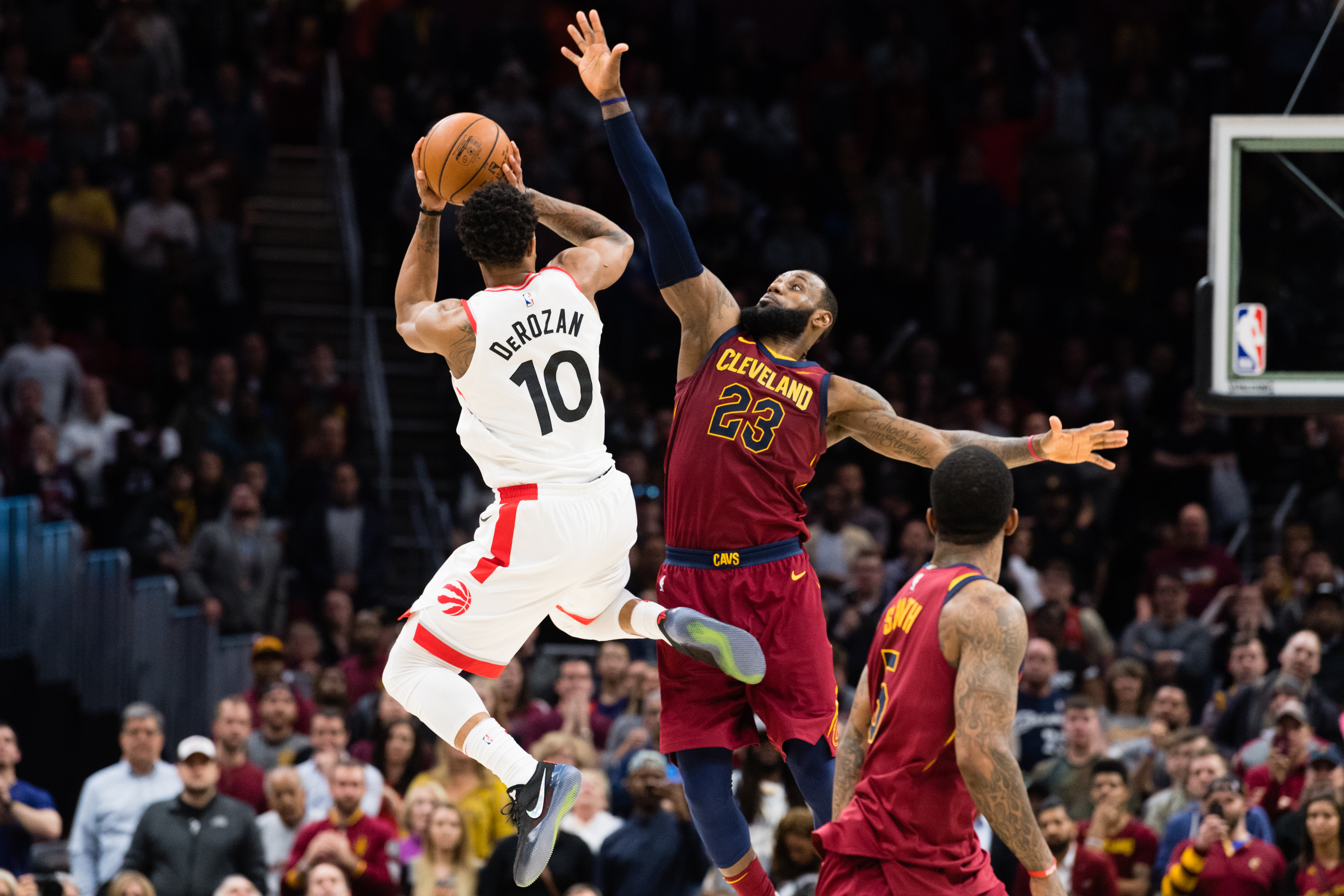 LeBron James defends DeMar DeRozan during a game in 2018