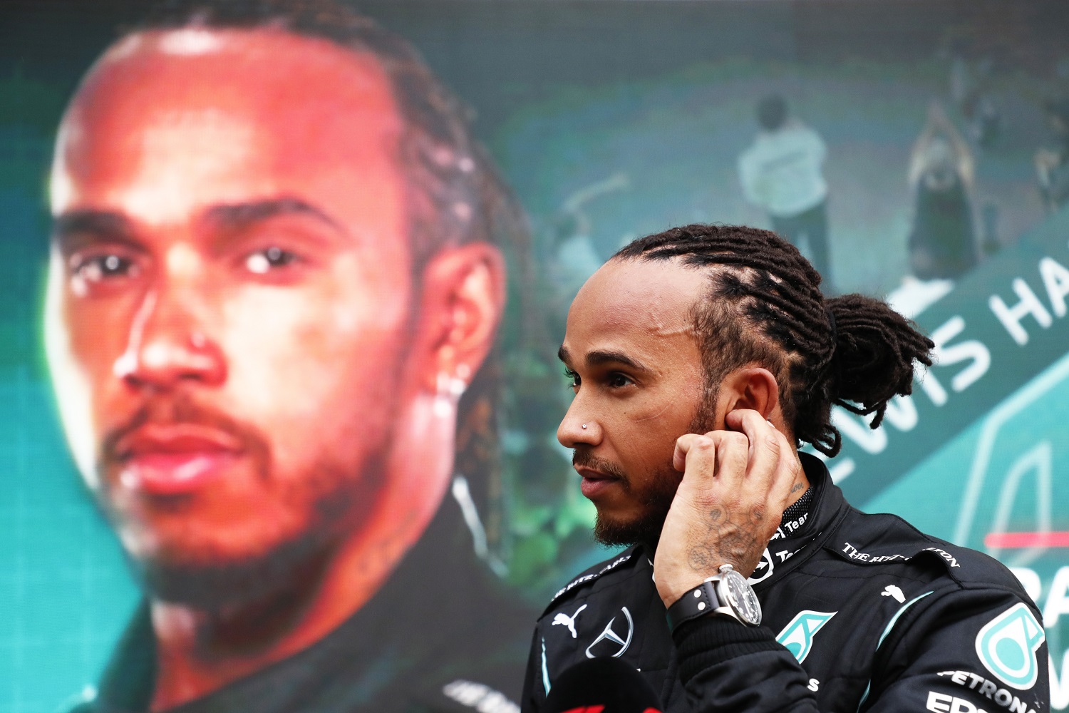 Race winner Lewis Hamilton of Great Britain and Mercedes GP looks on in parc ferme during the F1 Grand Prix of Russia at Sochi Autodrom on Sept. 26, 2021 in Sochi, Russia.
