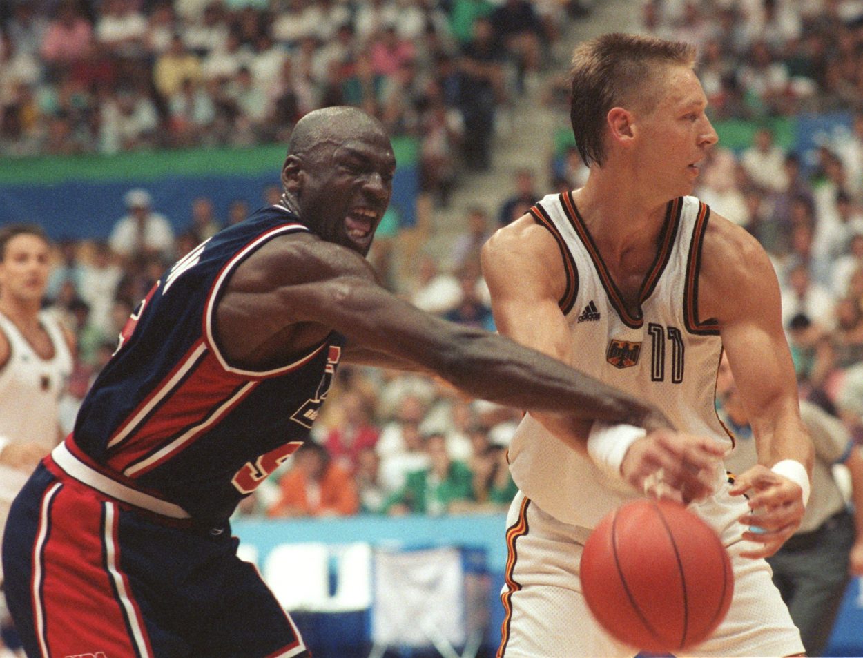 Former Bulls star Michael Jordan makes a play on Detlef Schrempf during the 1992 Olympics