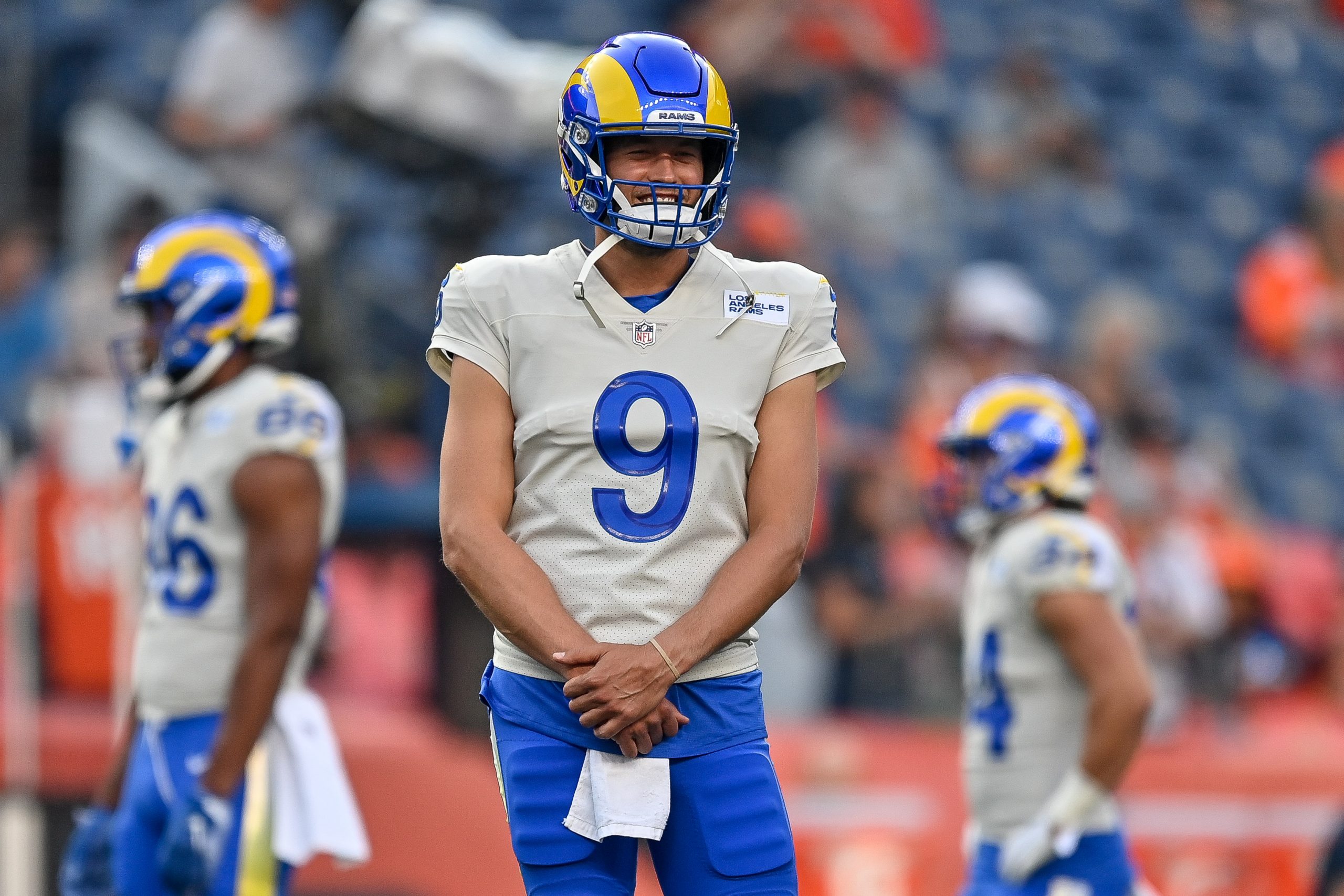 Matthew Stafford of the Los Angeles Rams looks on as players warm up.