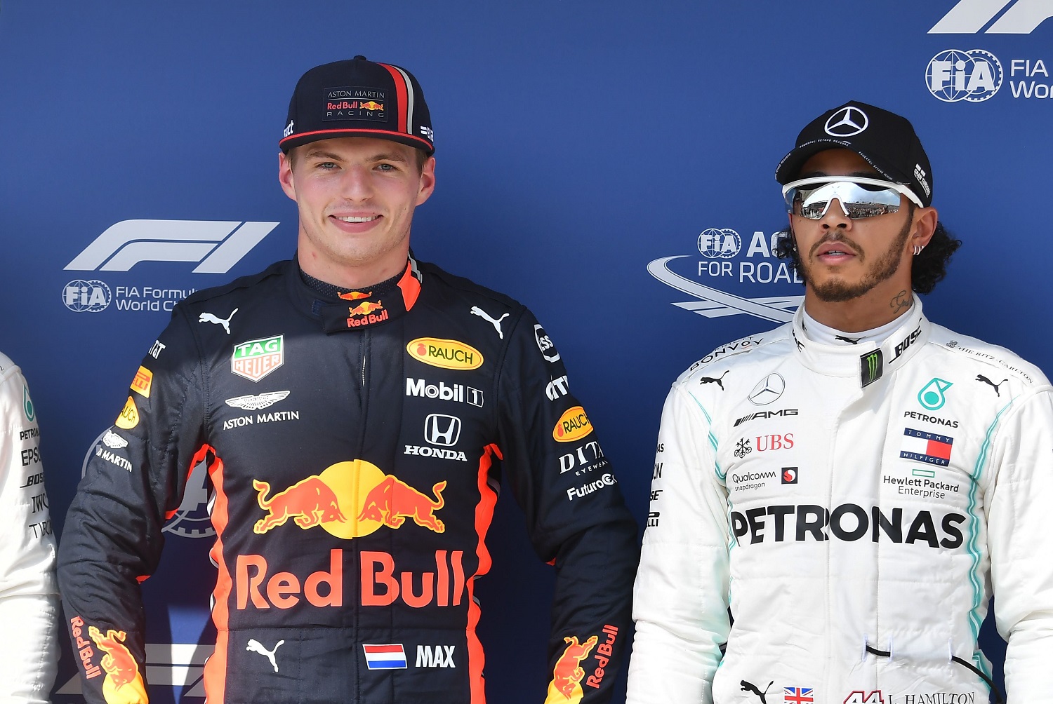 Red Bull's 0M0ax Verstappen and Mercedes' Lewis Hamilton pose after the qualifying session of the Formula 1 Hungarian Grand Prix on Aug. 3, 2019.