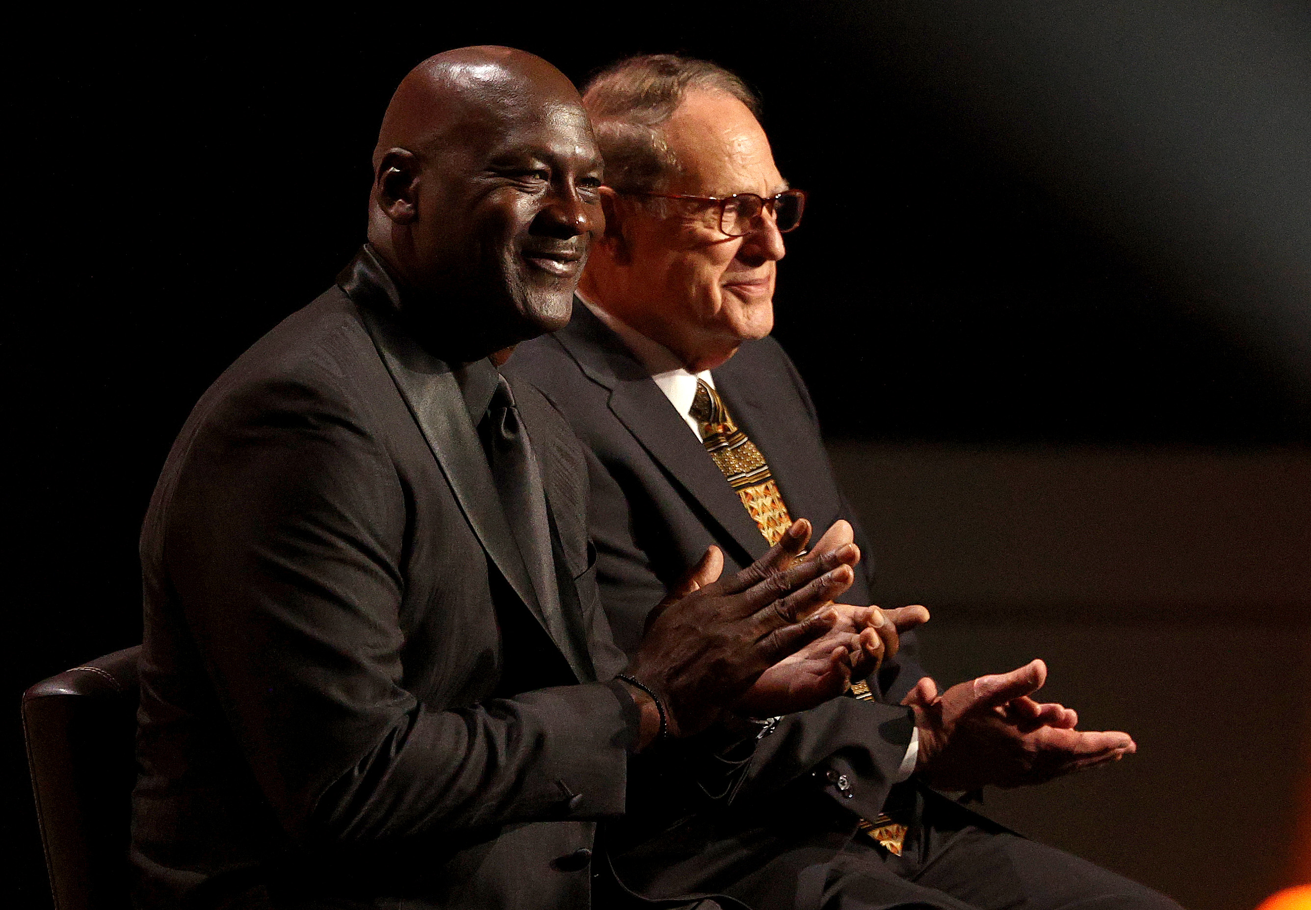 Michael Jordan claps during former Bulls teammate Toni Kukoc's induction into the Hall of Fame