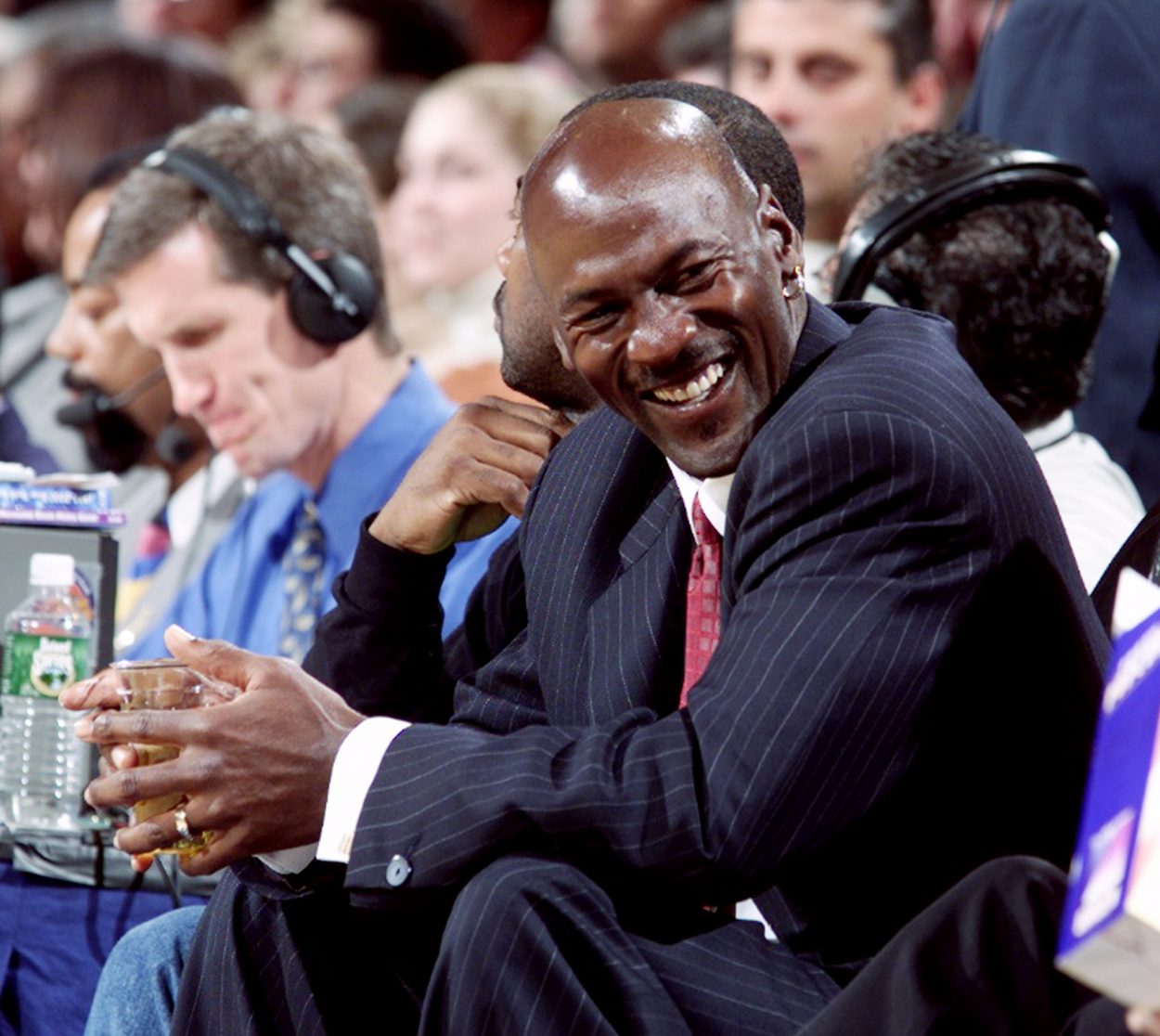 Bulls great Michael Jordan laughs while taking in a game at Madison Square Garden