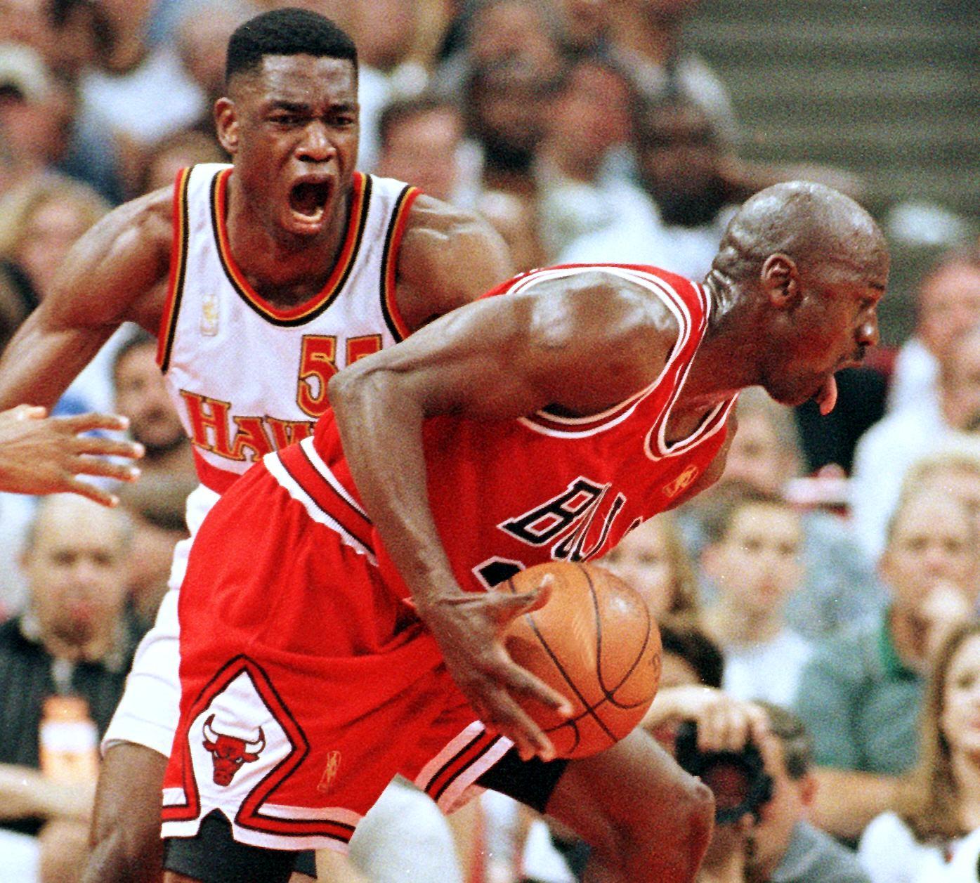 Michael Jordan drives on Dikembe Mutombo
