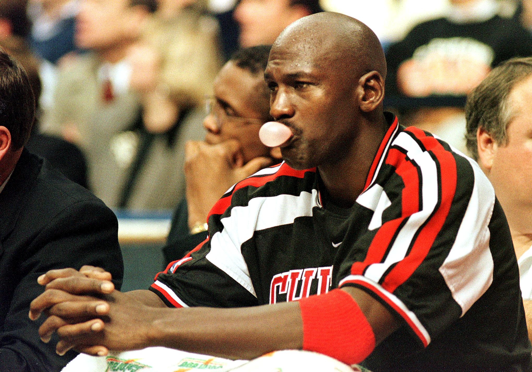 Bulls legend Michael Jordan sits on the bench during a gam against the Cleveland Cavaliers