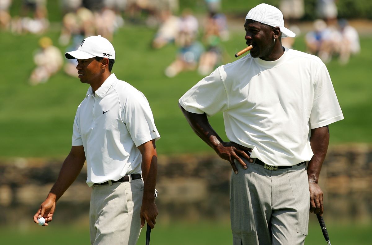 Sports legends Michael Jordan and Tiger Woods play golf while MJ smokes a cigar