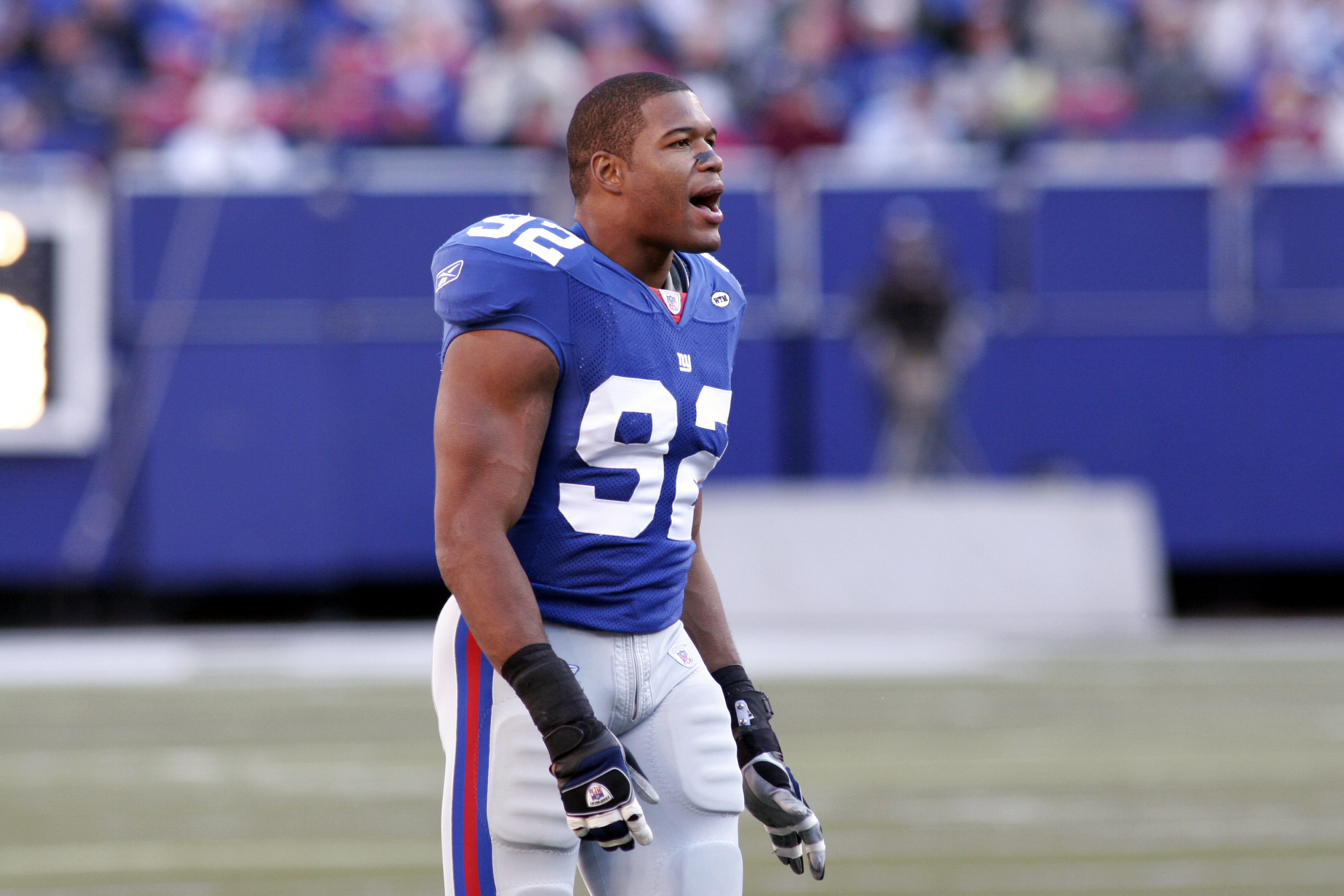 New York Giants defensive end Michael Strahan celebrates during a game