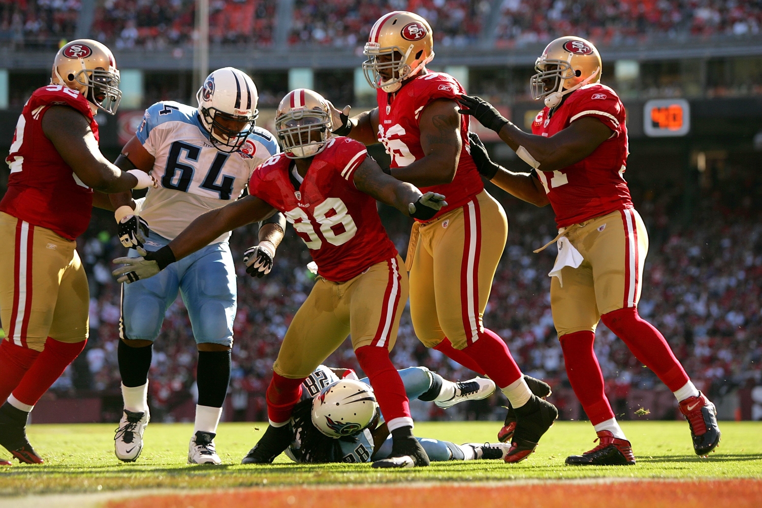 Linebacker Parys Haralson celebrates recording a sack with his San Francisco 49ers teammates.