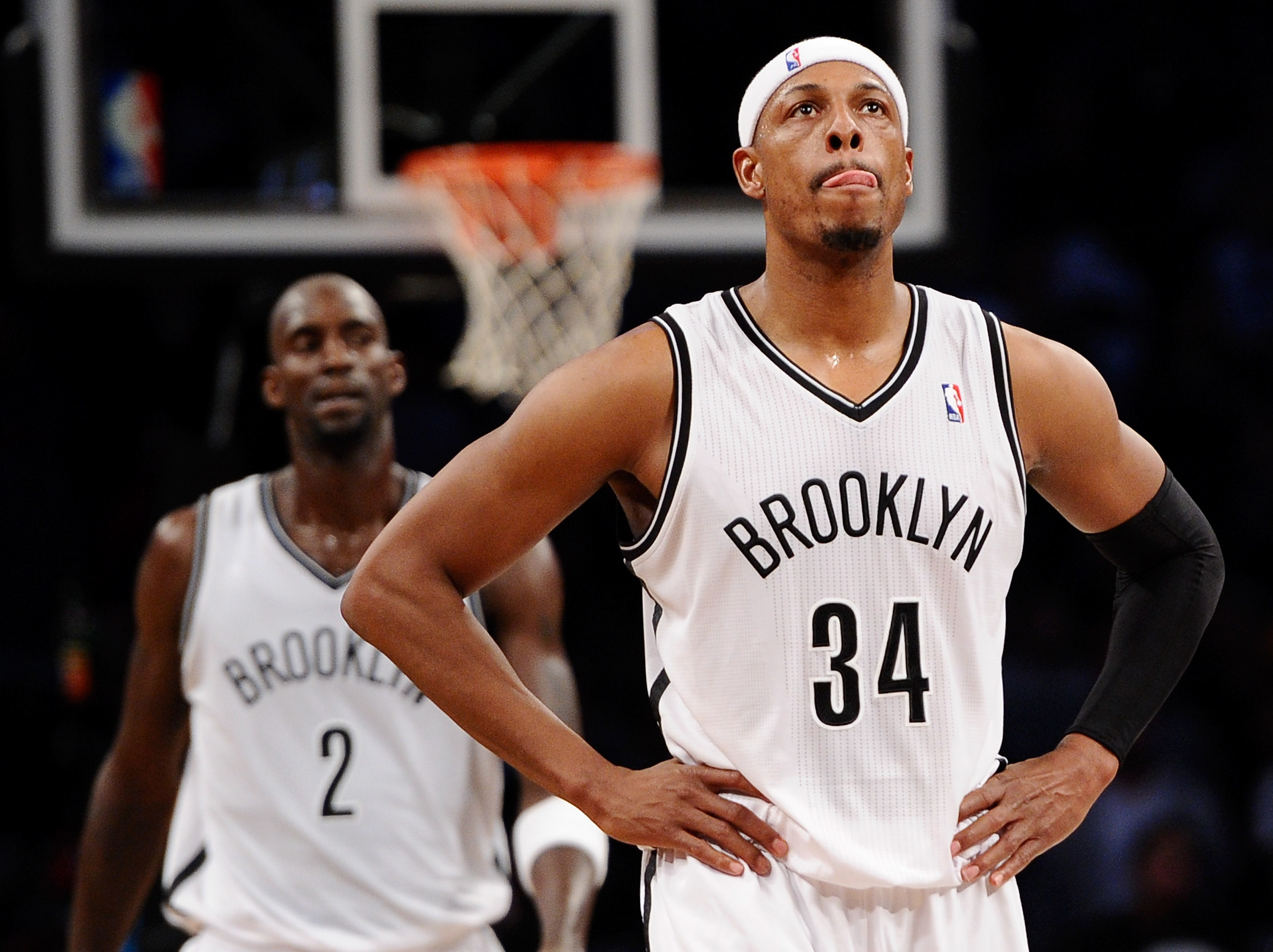 Paul Pierce looks on during a Brooklyn Nets game in 2013