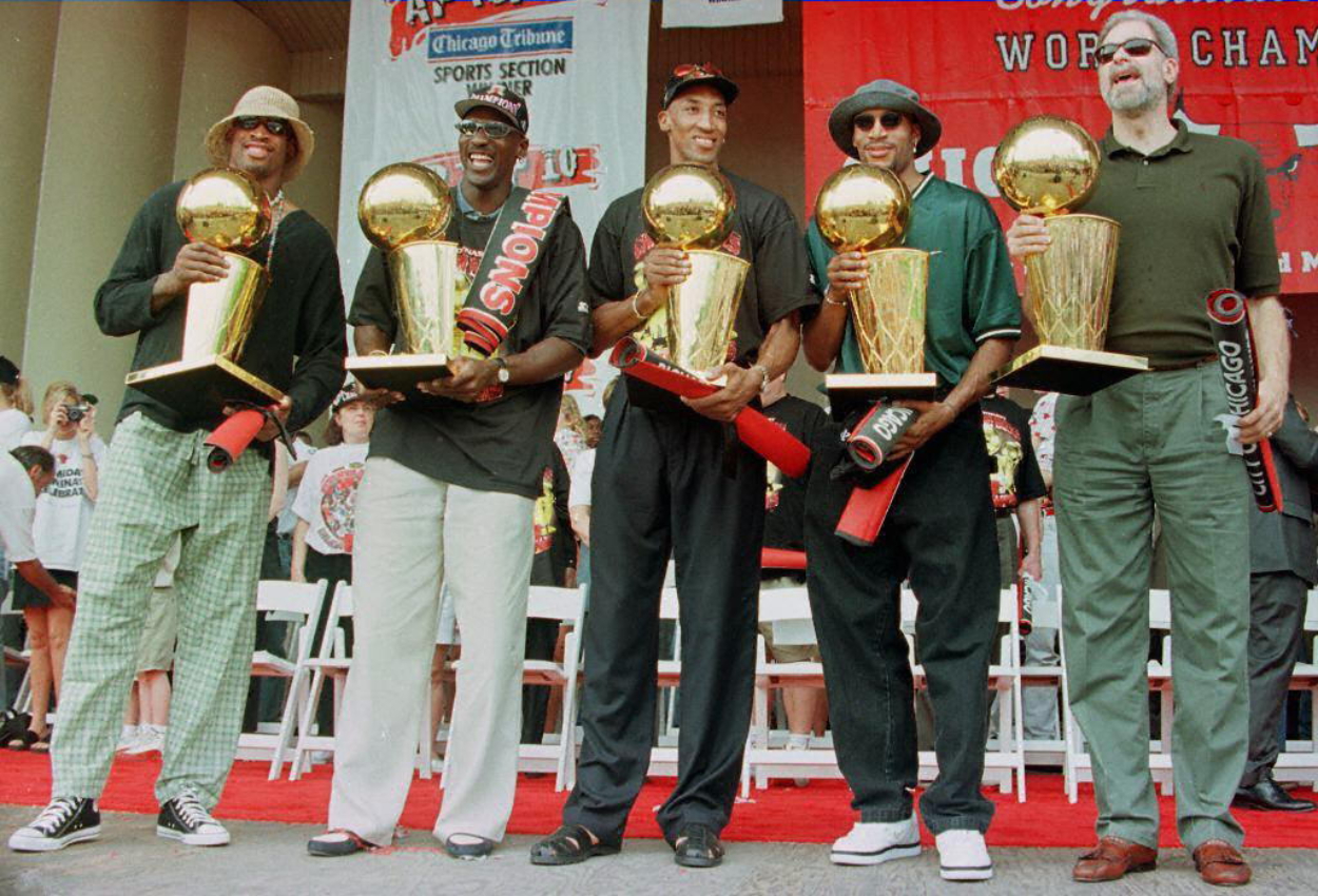 Dennis Rodman, Michael Jordan, Scottie Pippen, Ron Harper and Phil Jackson after winning the Bulls' fifth NBA title.
