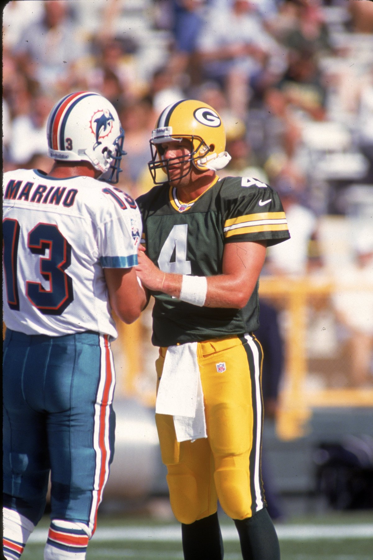 Quarterback Brett Favre of the Green Bay Packers greets Miami Dolphins quarterback Dan Marino before a 20-0 win at Lambeau Field in 1997