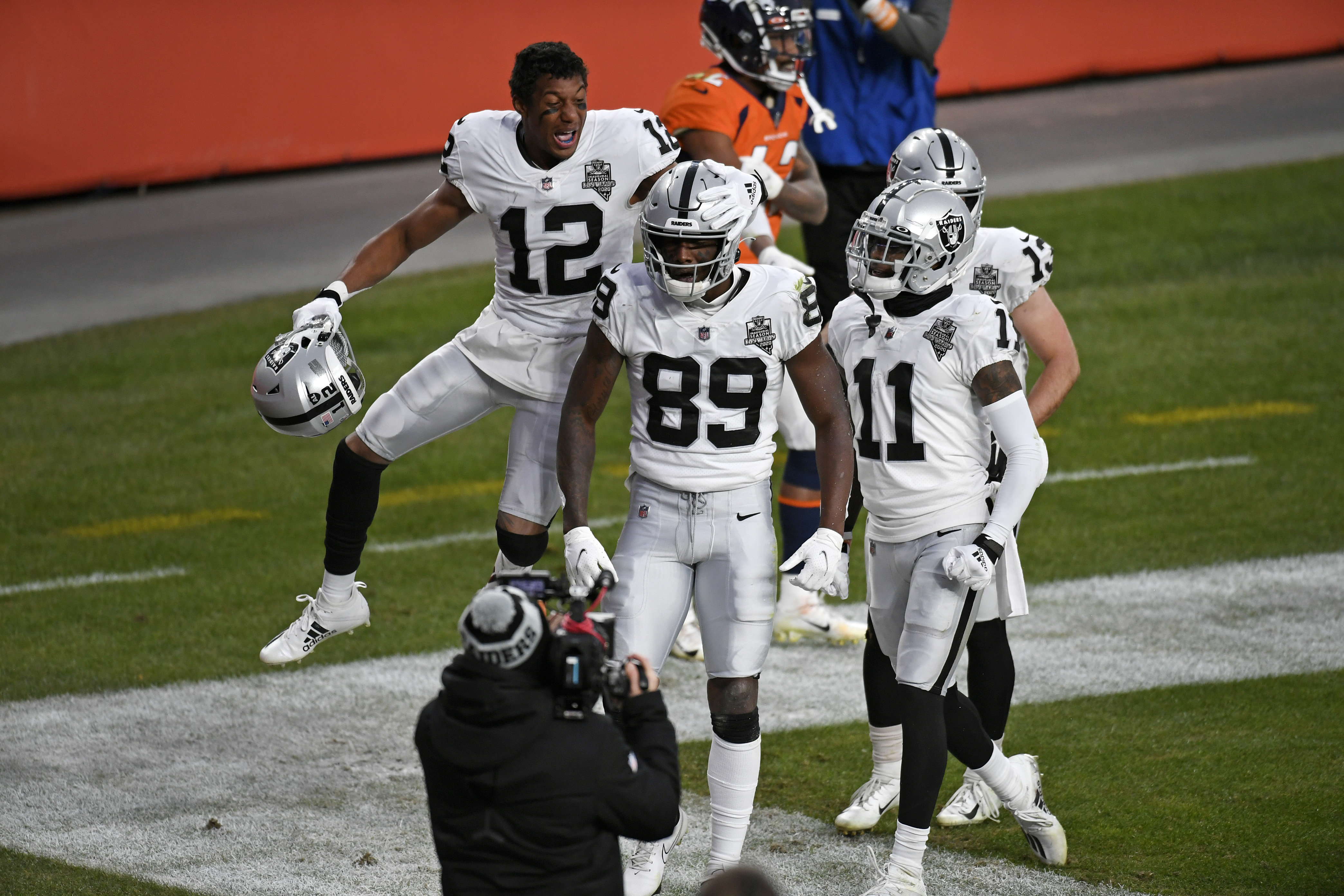 Las Vegas Raiders wide receivers celebrate in the end zone after a touchdown