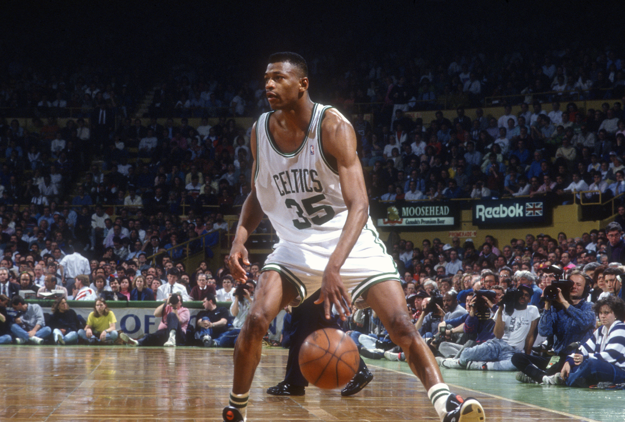 Reggie Lewis of the Boston Celtics dribbles the ball during an NBA basketball game circa 1991.