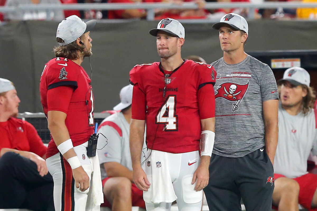 Blaine Gabbert, Ryan Griffin, and Tom Brady of the Buccaneers watch the instant replay on the jumbotron