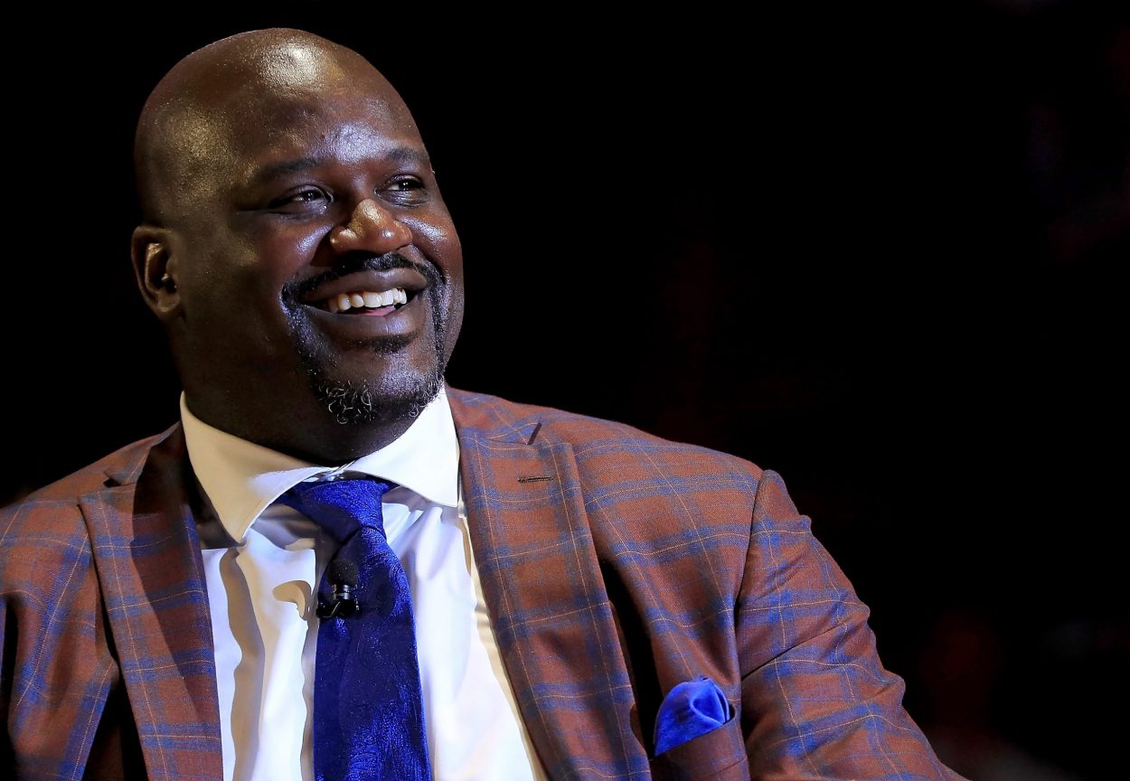 Lakers great and Hall of Fame center Shaquille O'Neal smiles as his jersey is retired by the Miami Heat