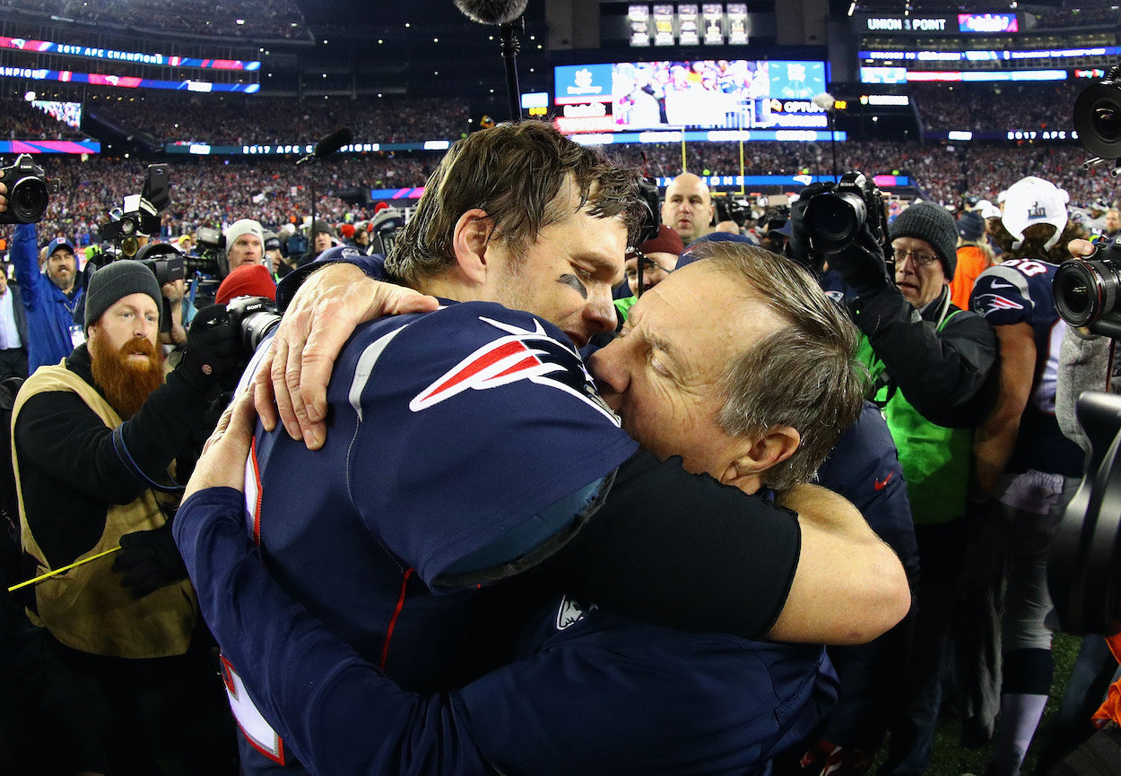 Tom Brady (now of the Tampa Bay Buccaneers) celebrates with New England Patriots head coach Bill Belichick after winning the AFC Championship Game against the Jacksonville Jaguars at Gillette Stadium on January 21, 2018 in Foxborough, Massachusetts. The two teamed up to deliver congratulatory messages to former New York Giants QB Eli Manning on 'Monday Night Football'.