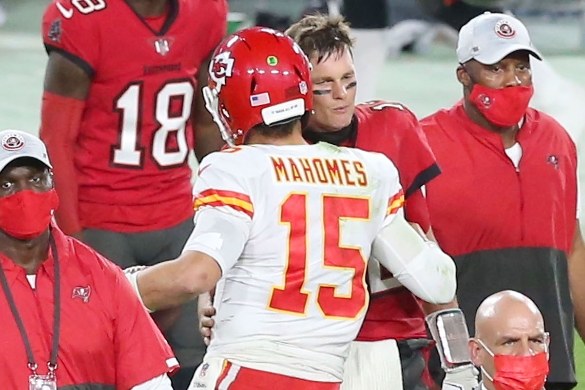 Tom Brady of the Buccaneers shakes hands with Patrick Mahomes of the Chiefs