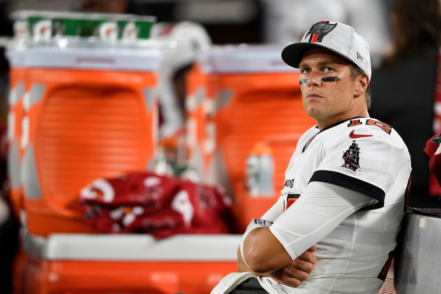 Tom Brady sits on the bench during a preseason game between the Tampa Bay Buccaneers and the Cincinnati Bengals.