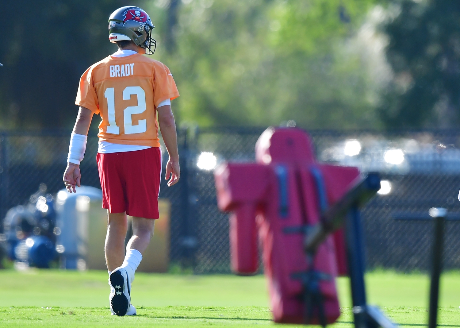 Tom Brady walks across the field during a training camp practice with the Tampa Bay Buccaneers.