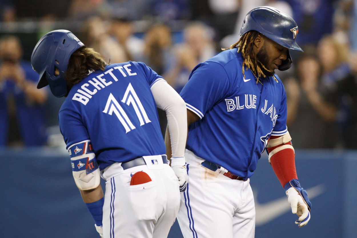 Vladimir Guerrero Jr., right, celebrates with Bo Bichette.