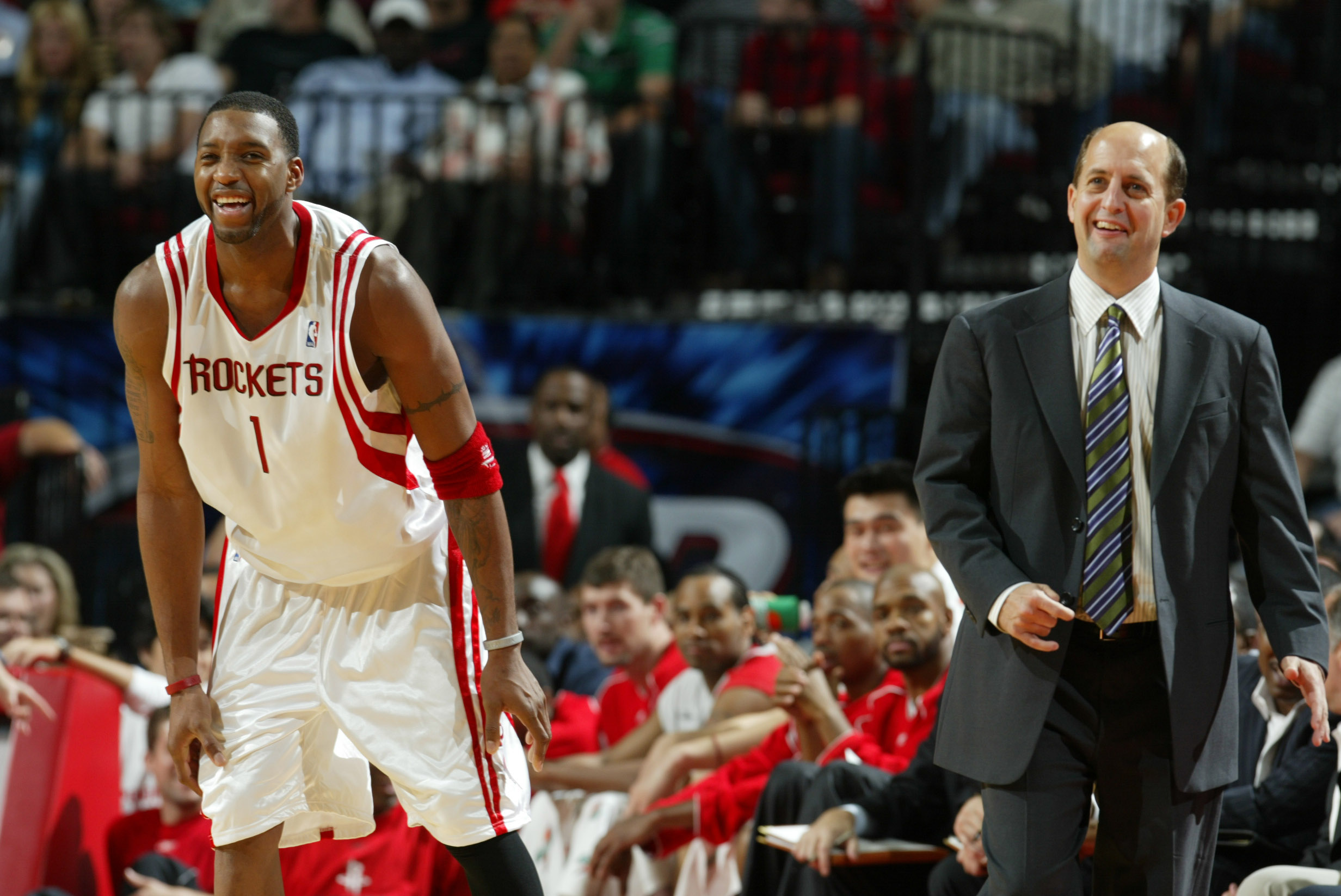 Tracy McGrady and Jeff Van Gundy smile during a Rockets-Kings matchup in 2005