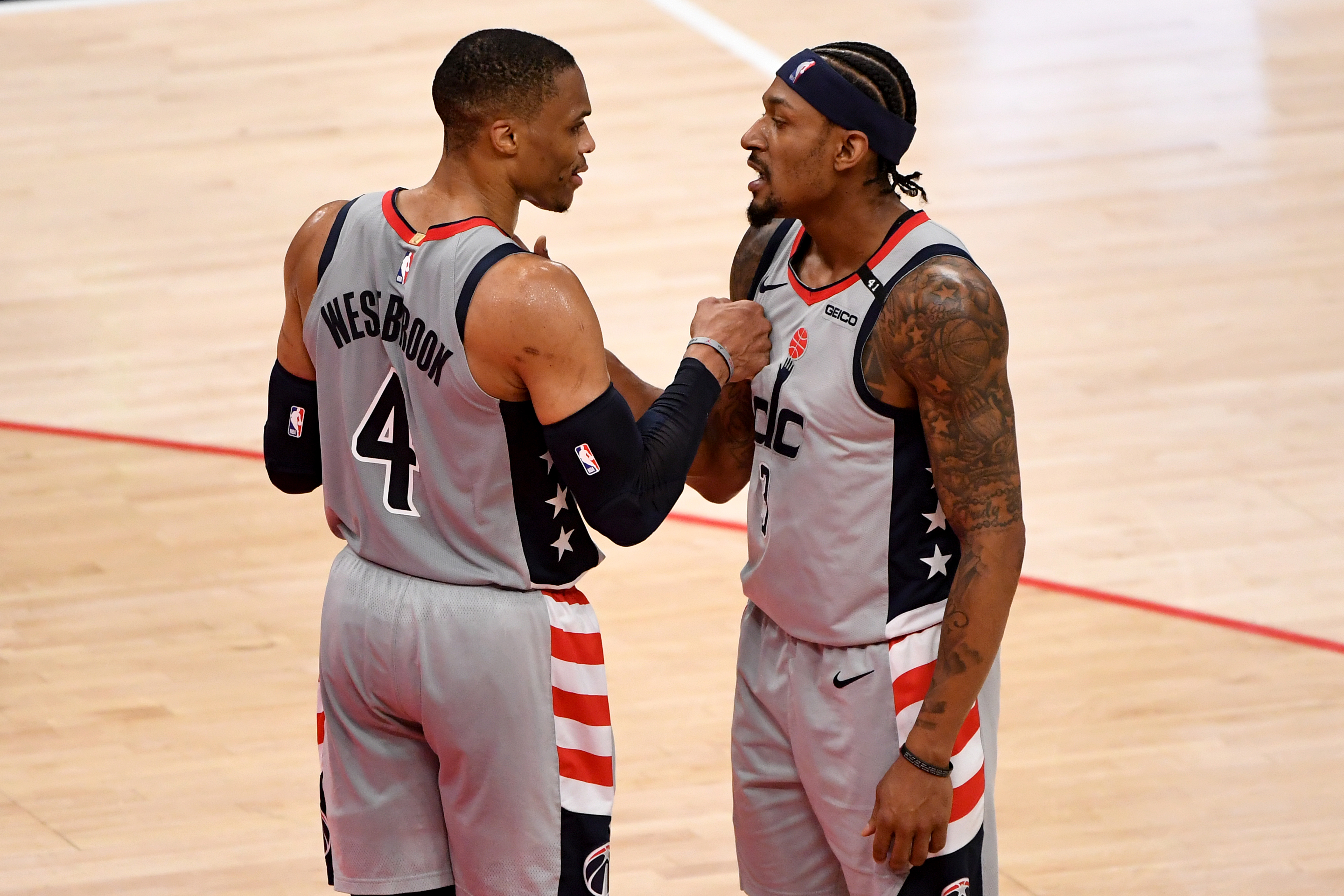 Former Wizards teammates Russell Westbrook and Bradley Beal celebrate during a playoff game