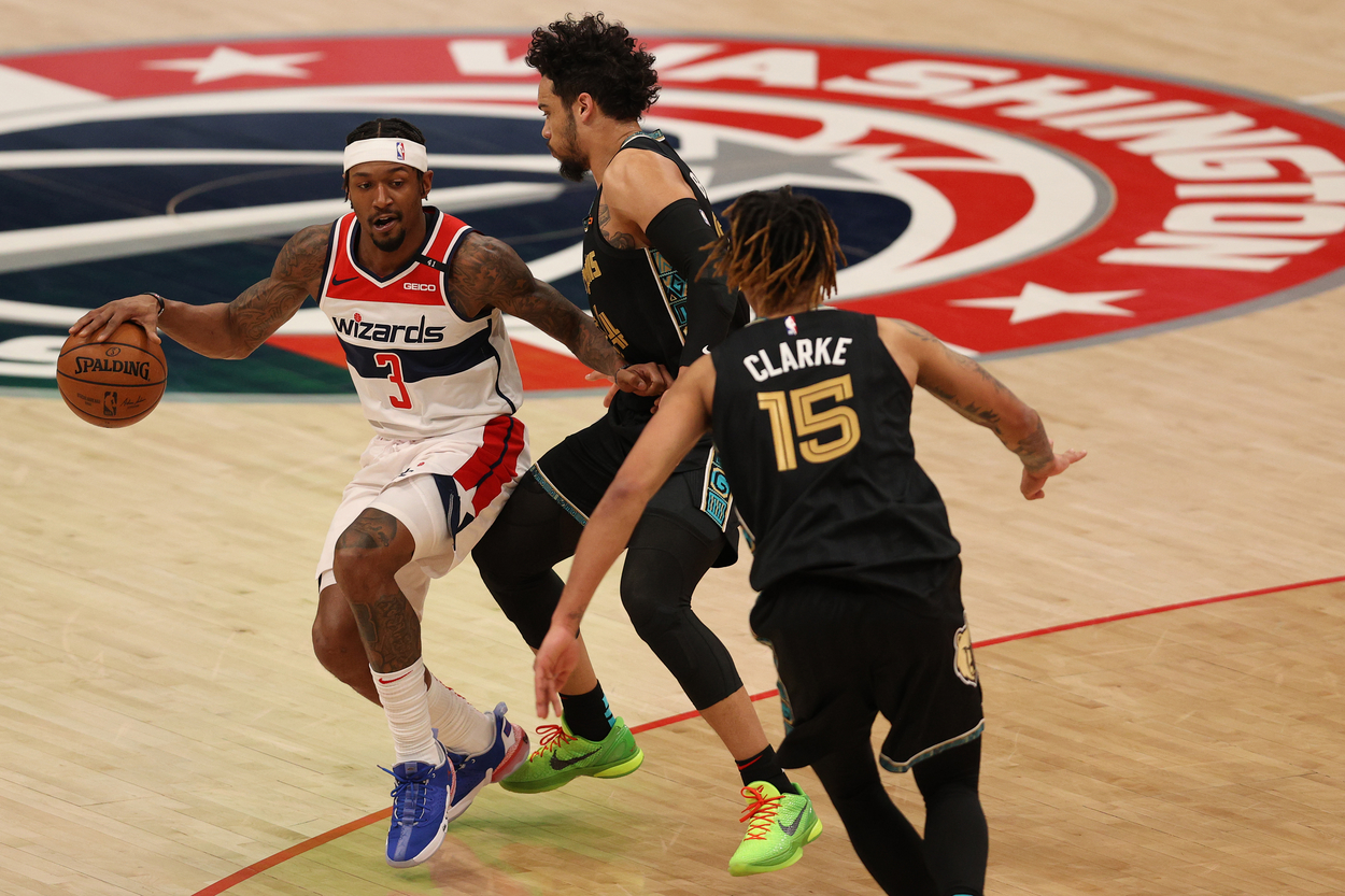 Bradley Beal moves to get around the Grizzlies' double-team near the three-point line.