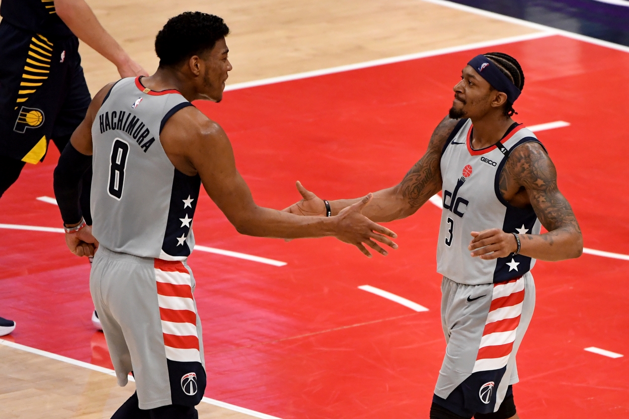 Bradley Beal and Rui Hachimura of the Washington Wizards celebrate after a play against the Indiana Pacers.