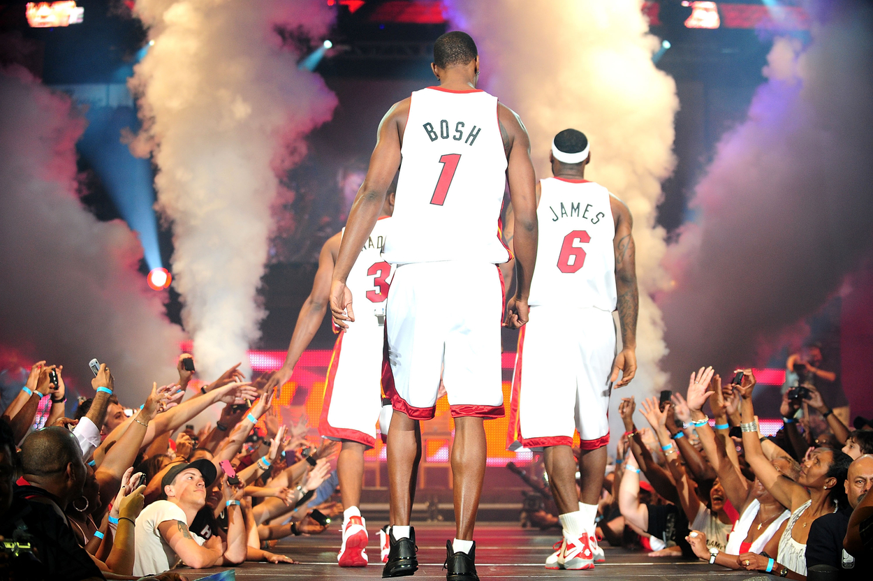 Chris Bosh, Dwayne Wade, and LeBron James of the Miami Heat are on stage and surrounded by fans at their Welcome Event.