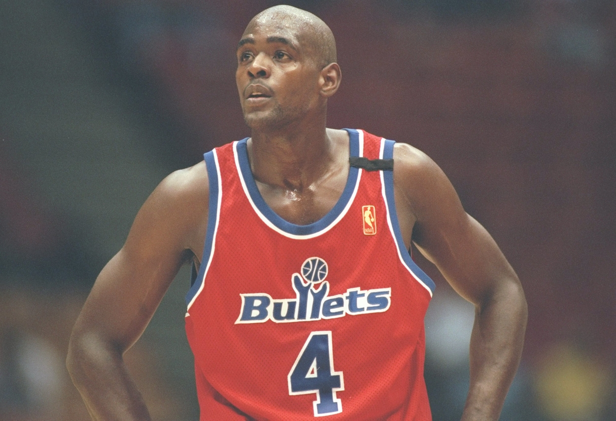 Chris Webber of the Washington Bullets looks on from the court in a game against the New Jersey Nets.