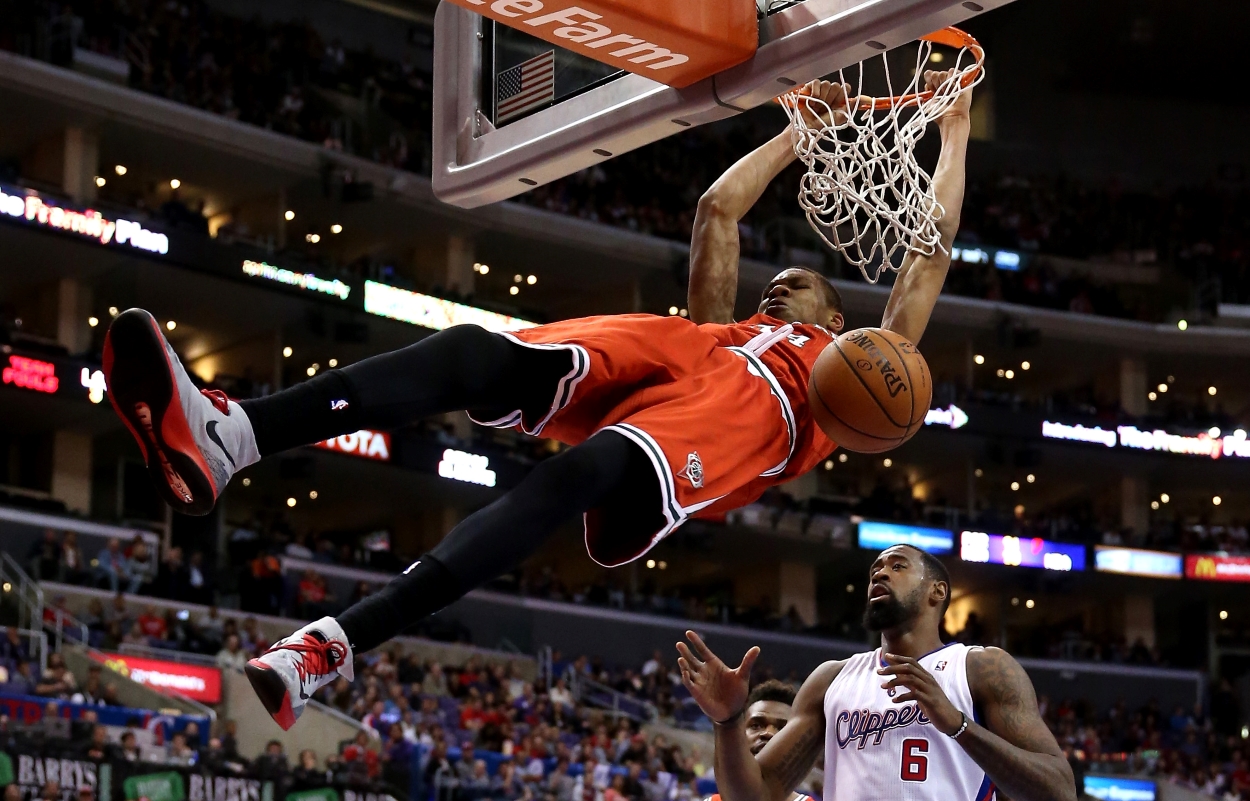Giannis Antetokounmpo of the Milwaukee Bucks dunks over DeAndre Jordan of the Los Angeles Clippers and a future member of the New York Knicks.
