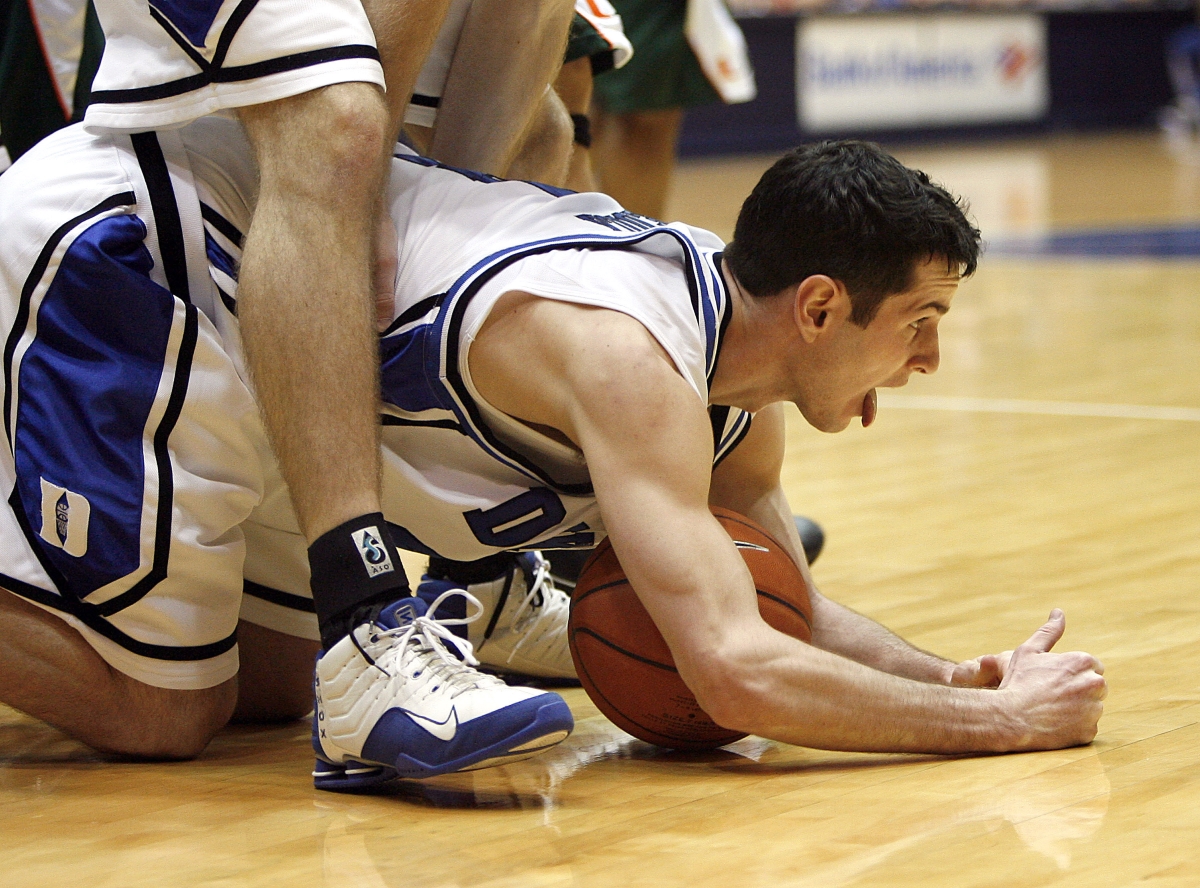 Duke's J.J. Redick reacts after grabbing a loose ball and a foul.
