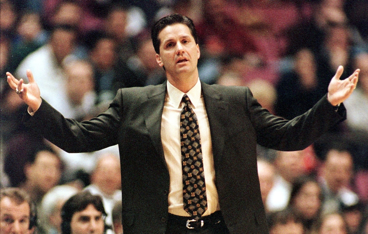 New Jersey Nets head coach John Calipari lifts up his arms in despair during the game.