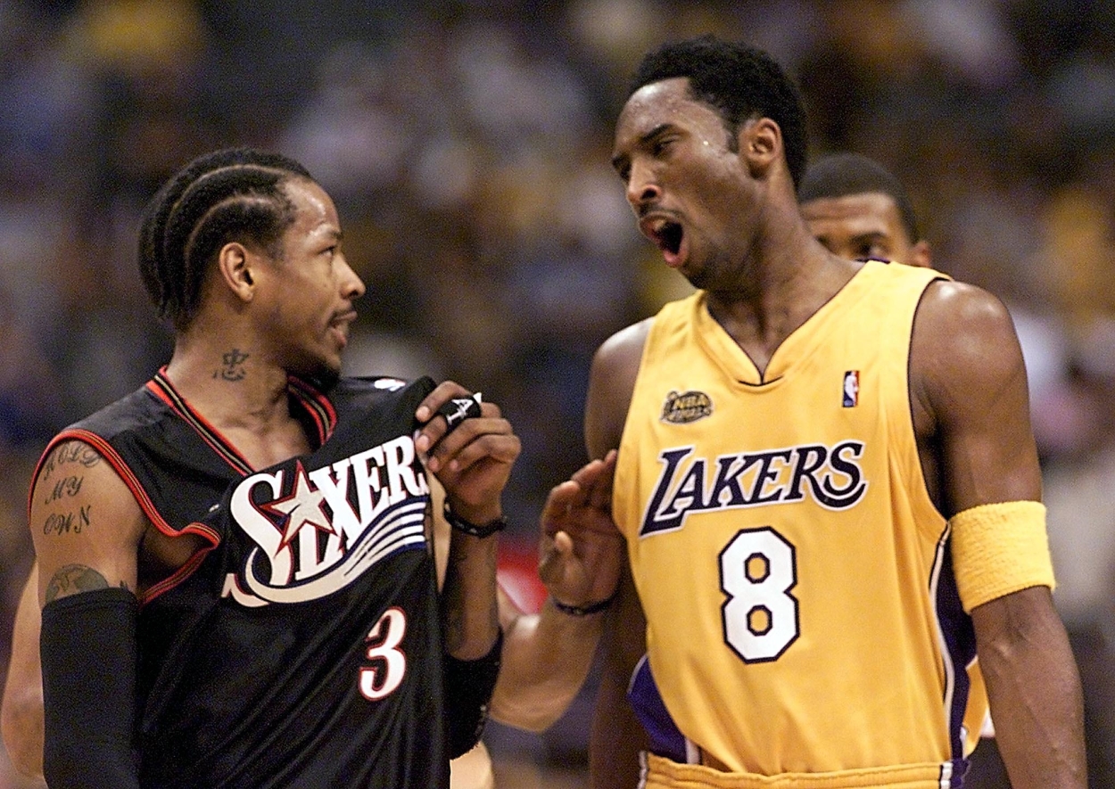 Kobe Bryant of the Los Angeles Lakers and Allen Iverson of the Philadelphia 76ers chat during a game in the 2001 NBA Finals.