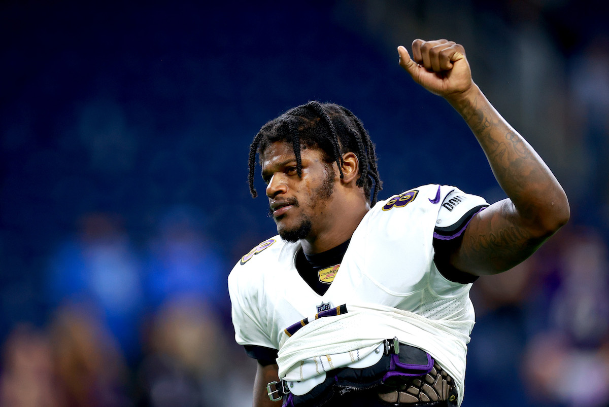 Lamar Jackson stretches during warm-ups prior to a game