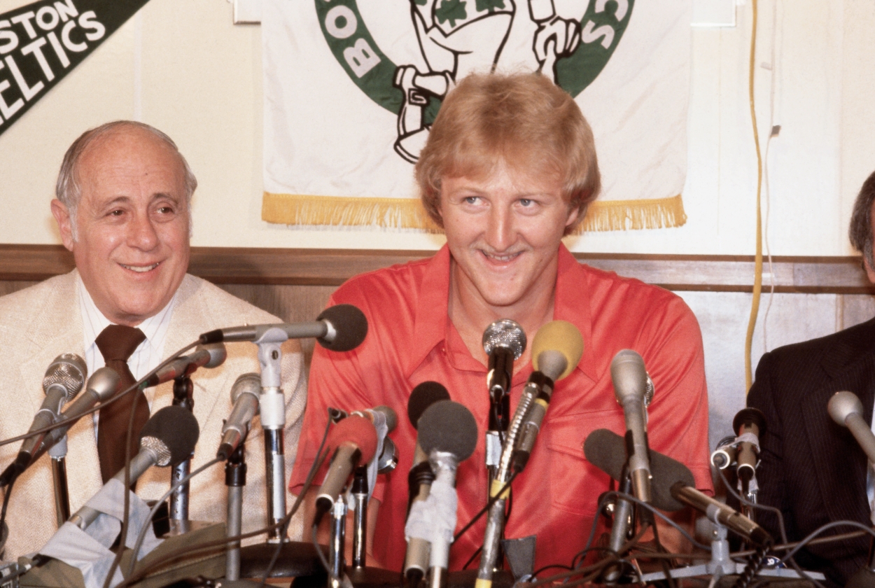 Larry Bird smiles with Boston Celtics general manager Red Auerbach after arriving in the NBA from Indiana State.