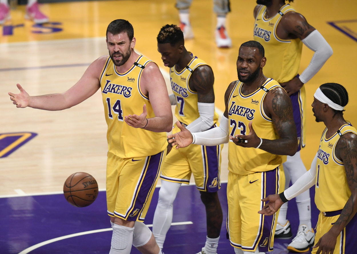Marc Gasol lifts his arms in frustration, as does LeBron James, after he and the Lakers are called for a foul.